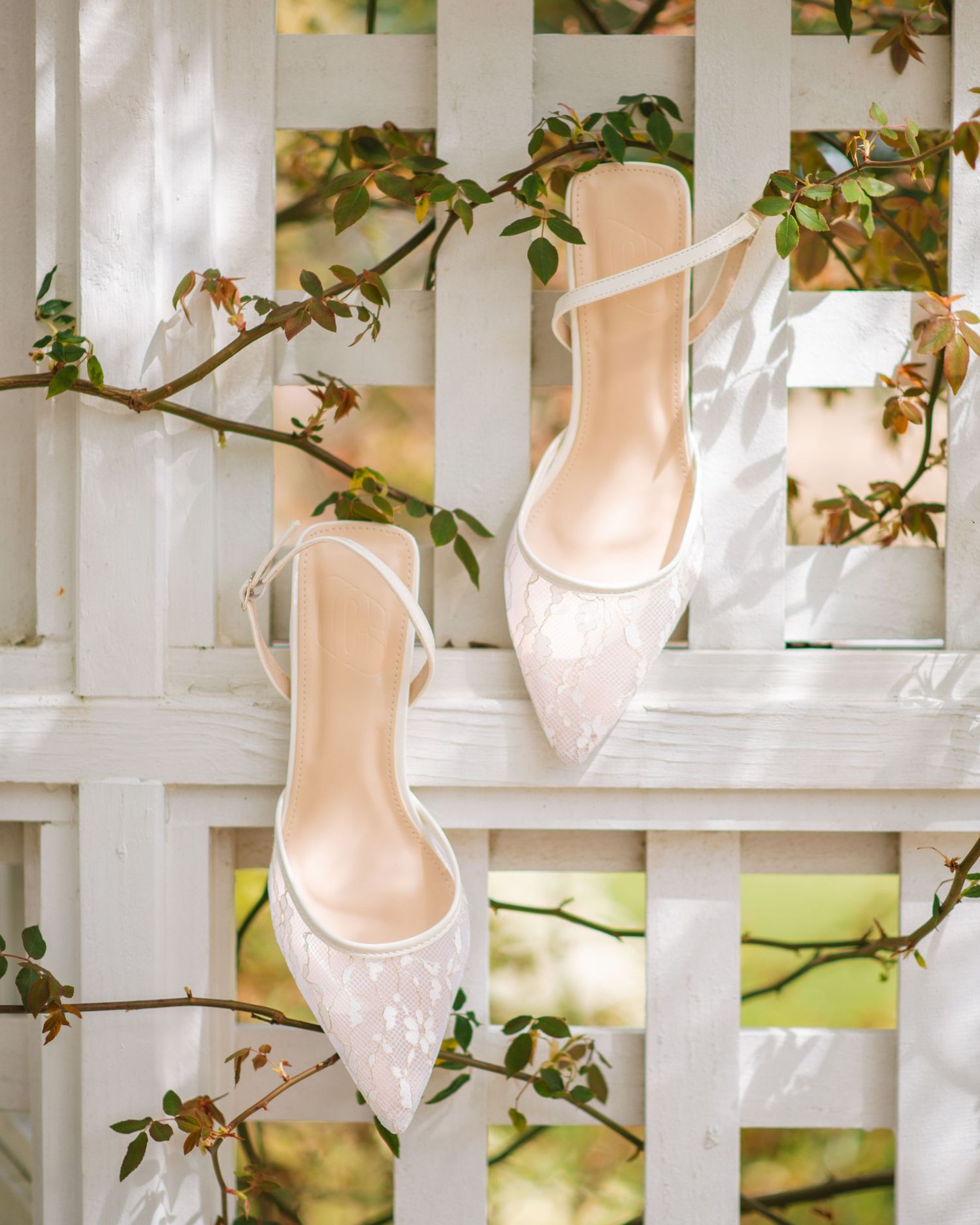 Elegant bridal heels displayed with greenery for a soft and romantic wedding detail photo. Magnolia Plantation and Gardens