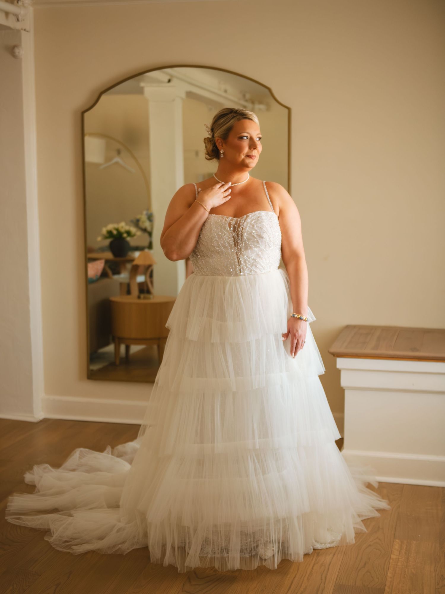 Bride posing in wedding dress indoors during an elegant bridal portrait session.
At Alhambra Hall Charleston SC