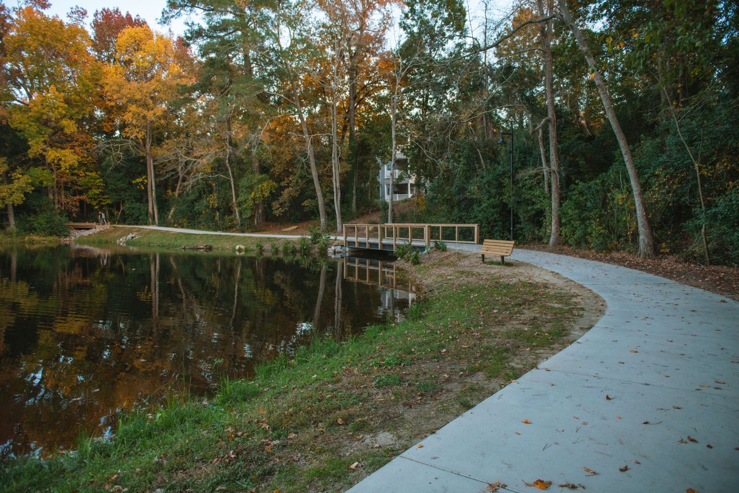 Old Mill Pond in Lexington SC, a charming family photo spot with water, rustic scenery, greenery, and timeless outdoor portraits.