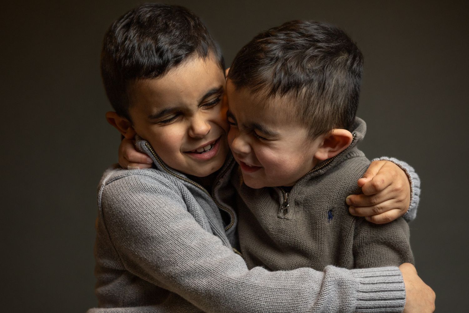 Two brothers hugging during a children's portrait session with a New Haven County CT photographer