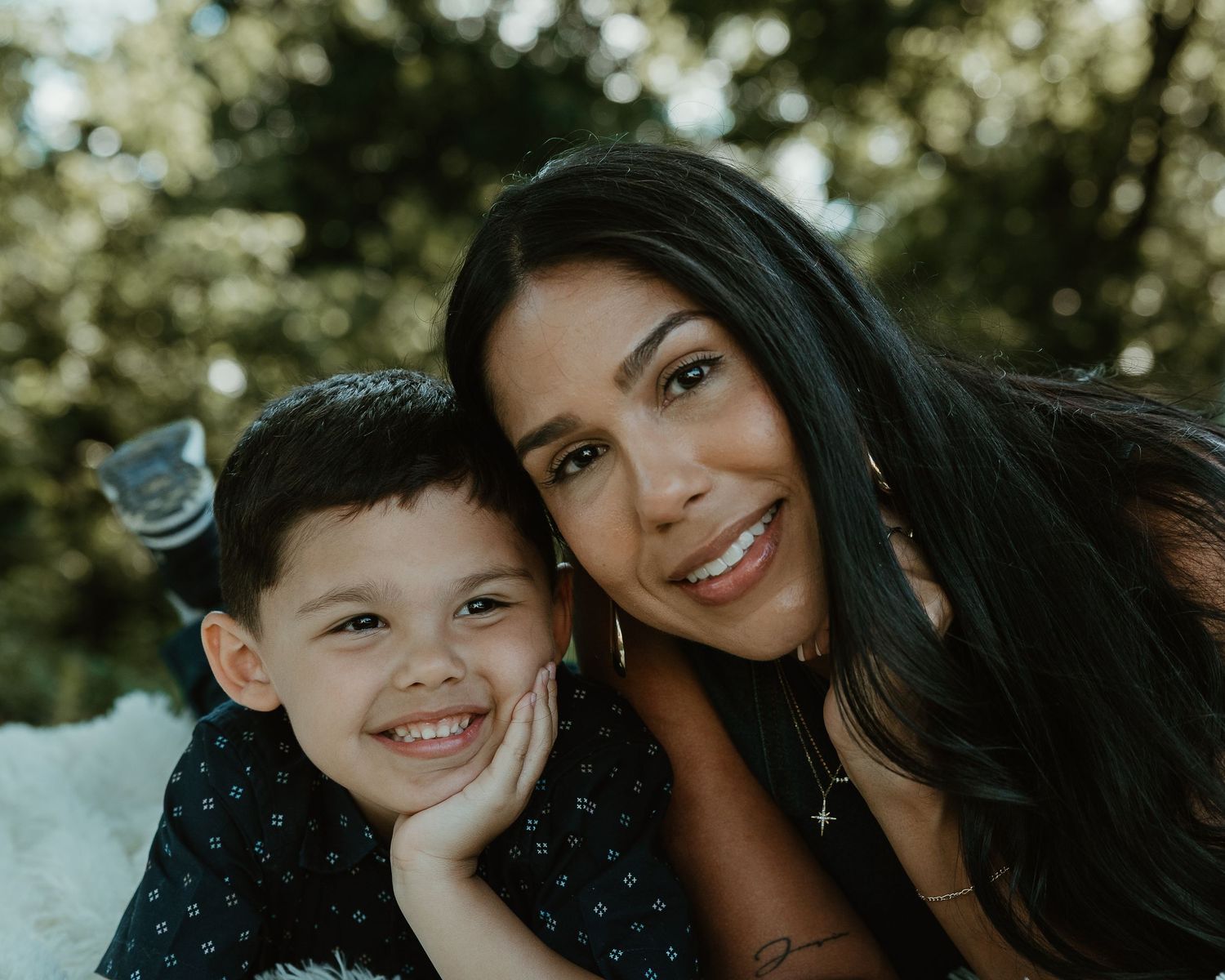 Mother and son smiling close together outdoors, Connecticut family photography session