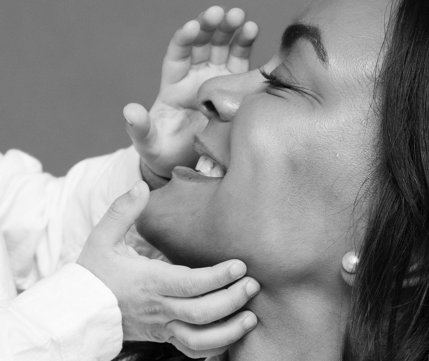 Black and white close-up portrait of a mother and child by a portrait photographer in New Haven County CT