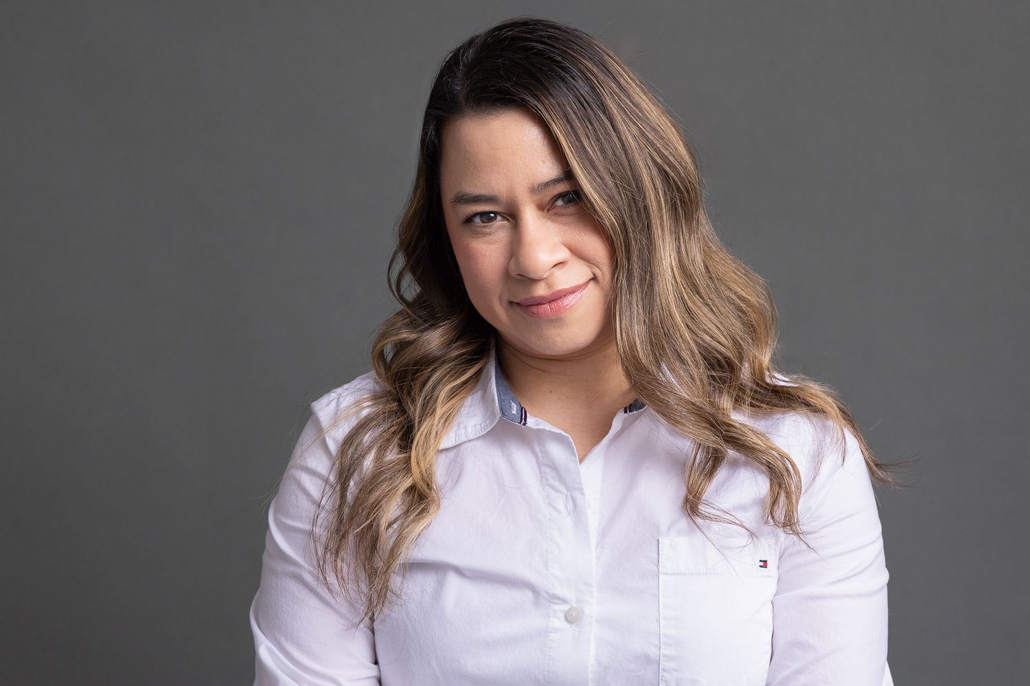 Professional headshot of a woman in a white blouse, Connecticut headshot photography