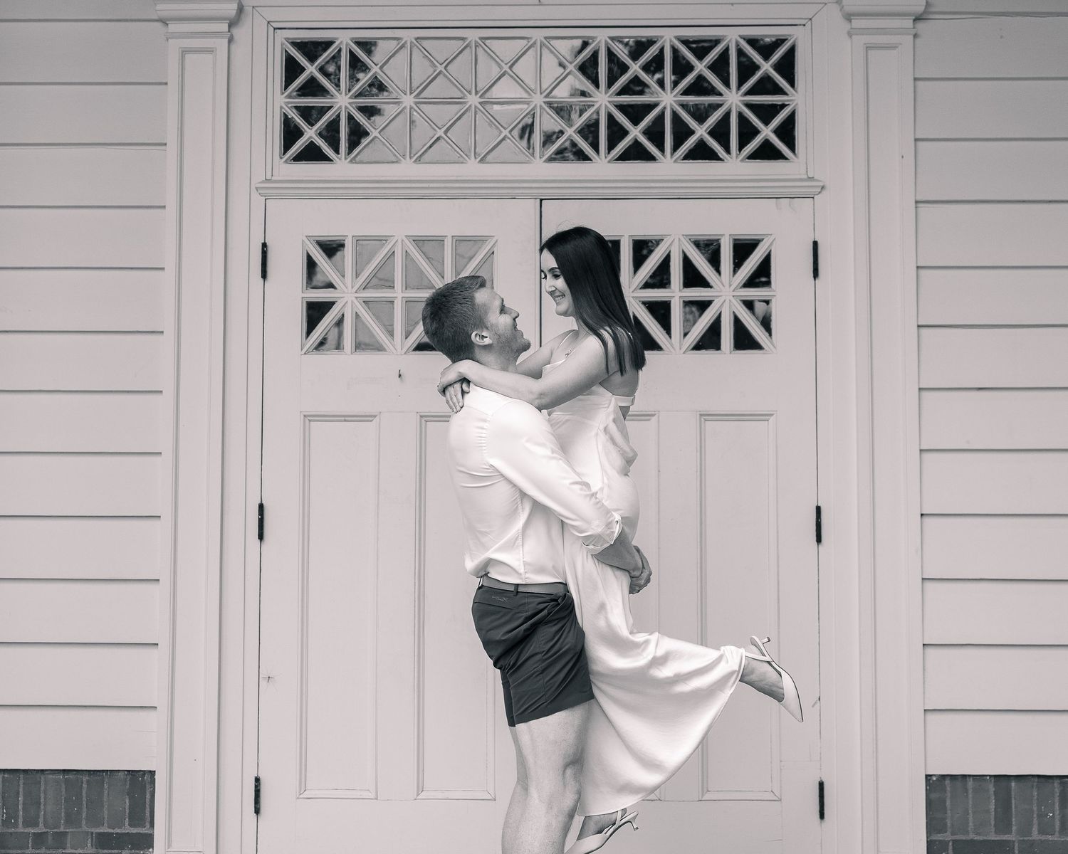 Couple lift portrait in front of Woodbridge Town Hall doors, CT elopement photographer