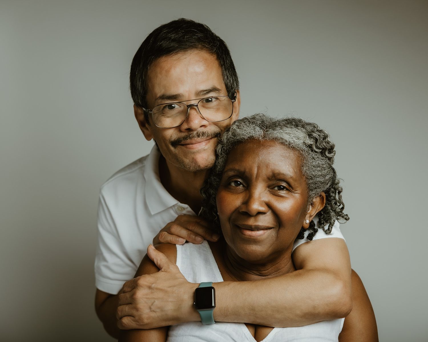 Husband and wife smiling together in studio portrait session, Woodbridge CT