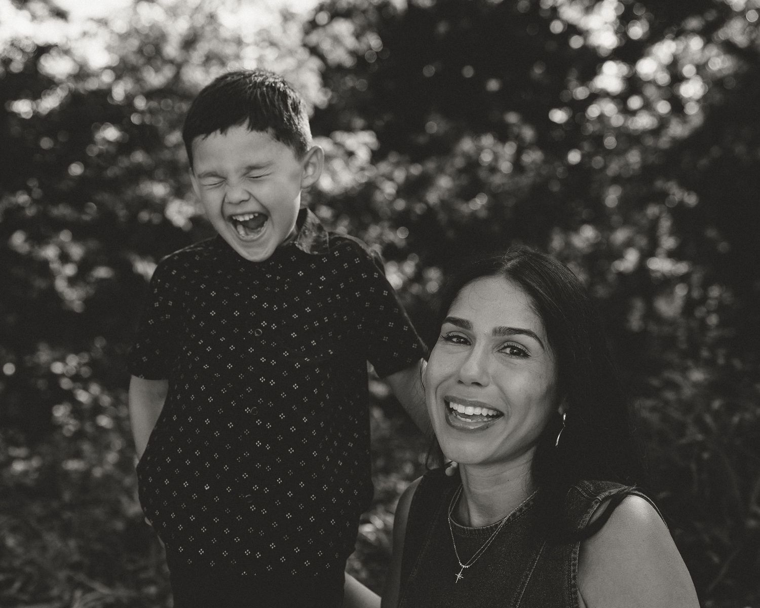 Black and white portrait of mother and laughing son outdoors, Connecticut family photography session