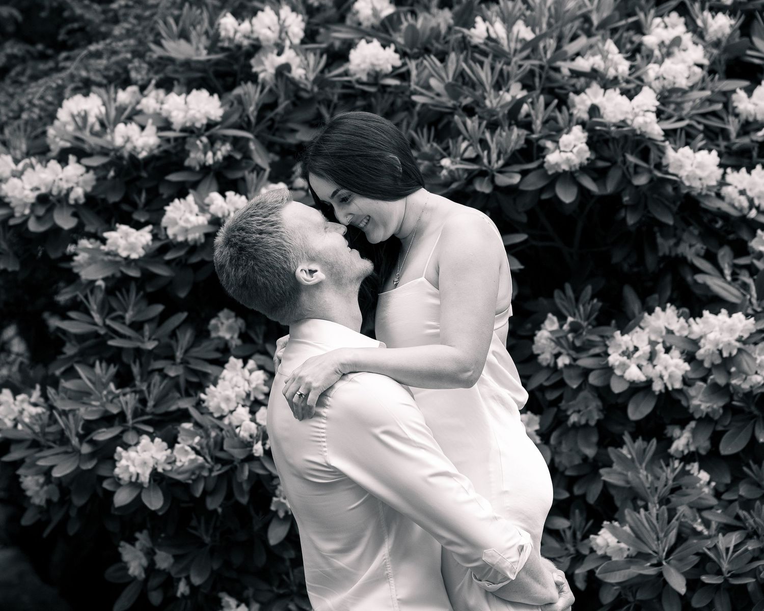 Couple lift portrait in rhododendron blooms, Woodbridge CT couples photographer