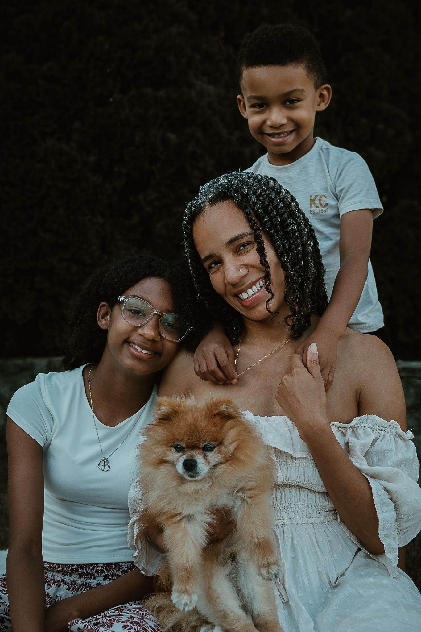 Family of three with their Pomeranian outdoors, Connecticut family photography session