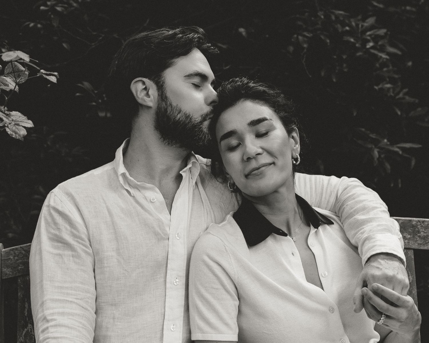 Black and white close-up of a couple, foreheads close together, tender moment during a Woodbridge, CT portrait session