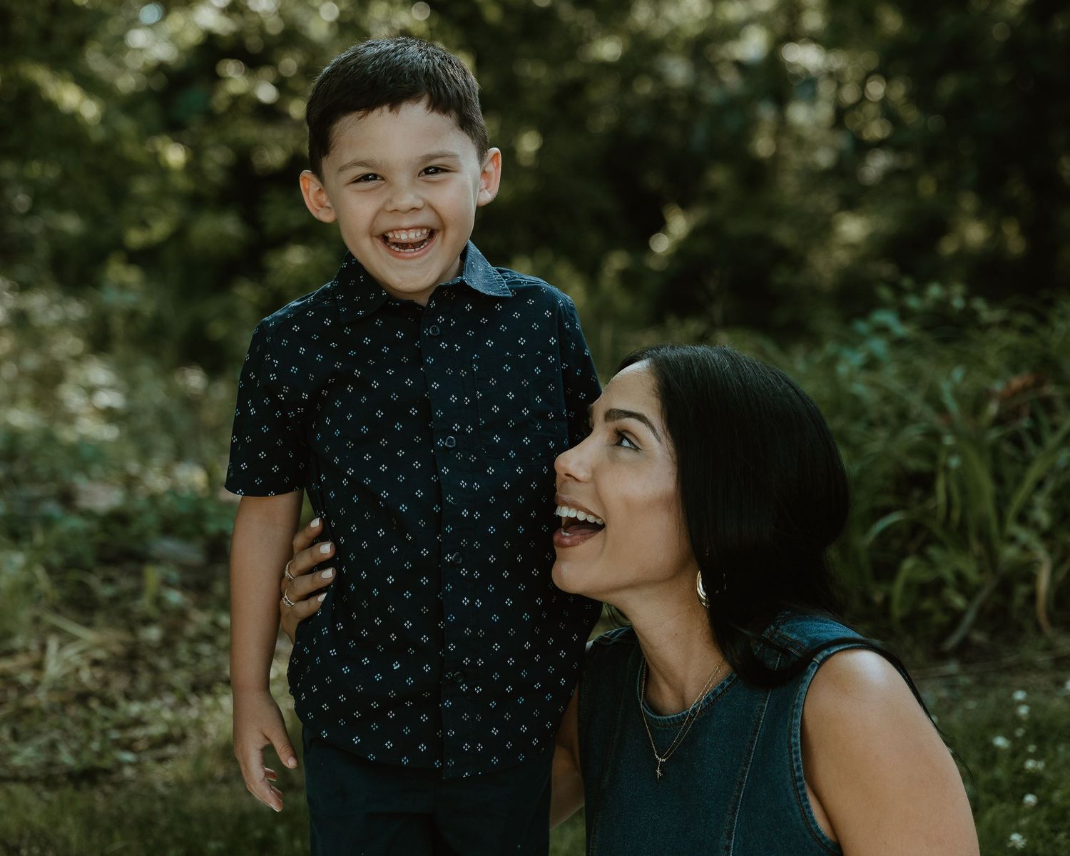 Mother gazing at her laughing son outdoors, family photographer Woodbridge CT