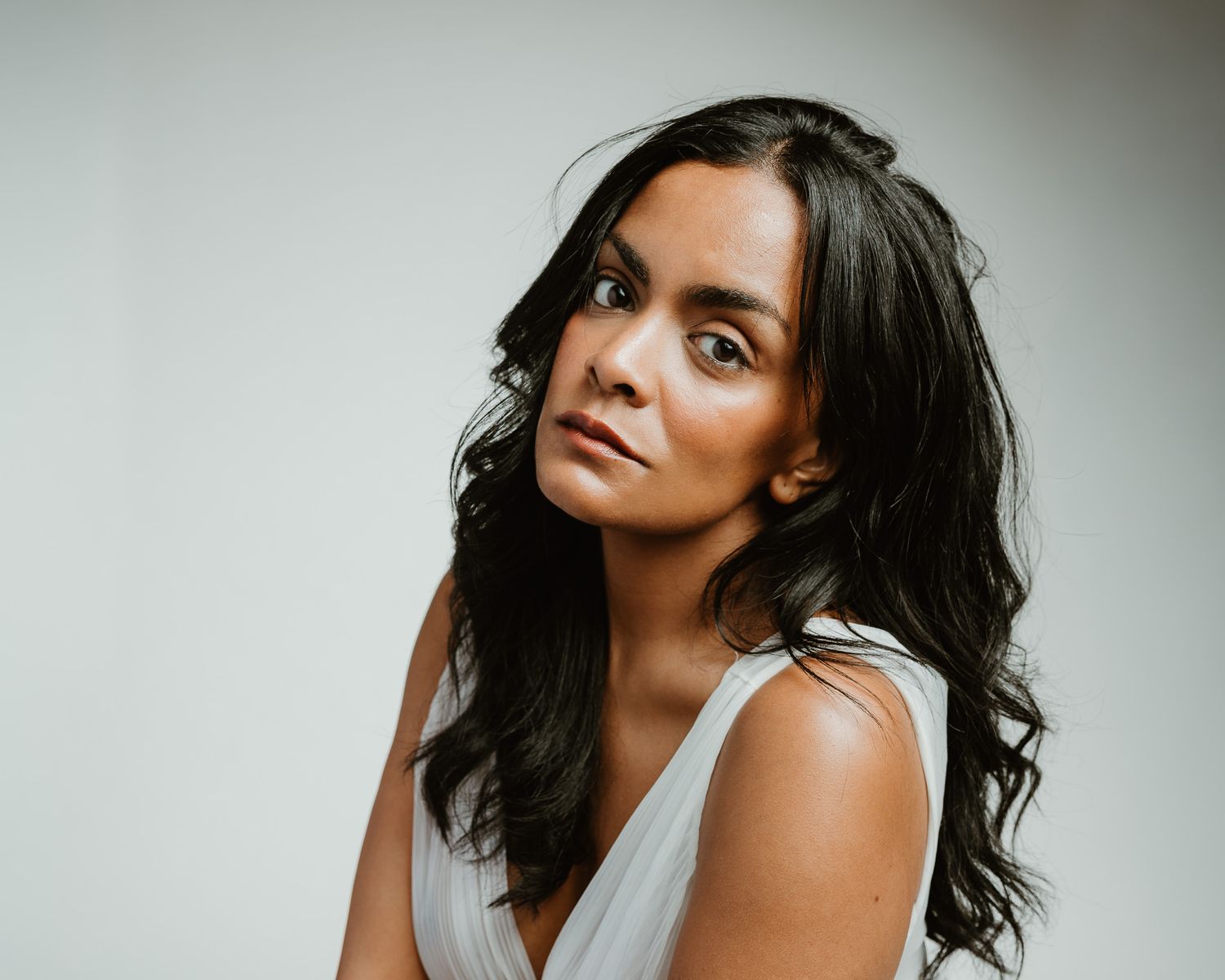 Draped fabric editorial portrait, direct gaze