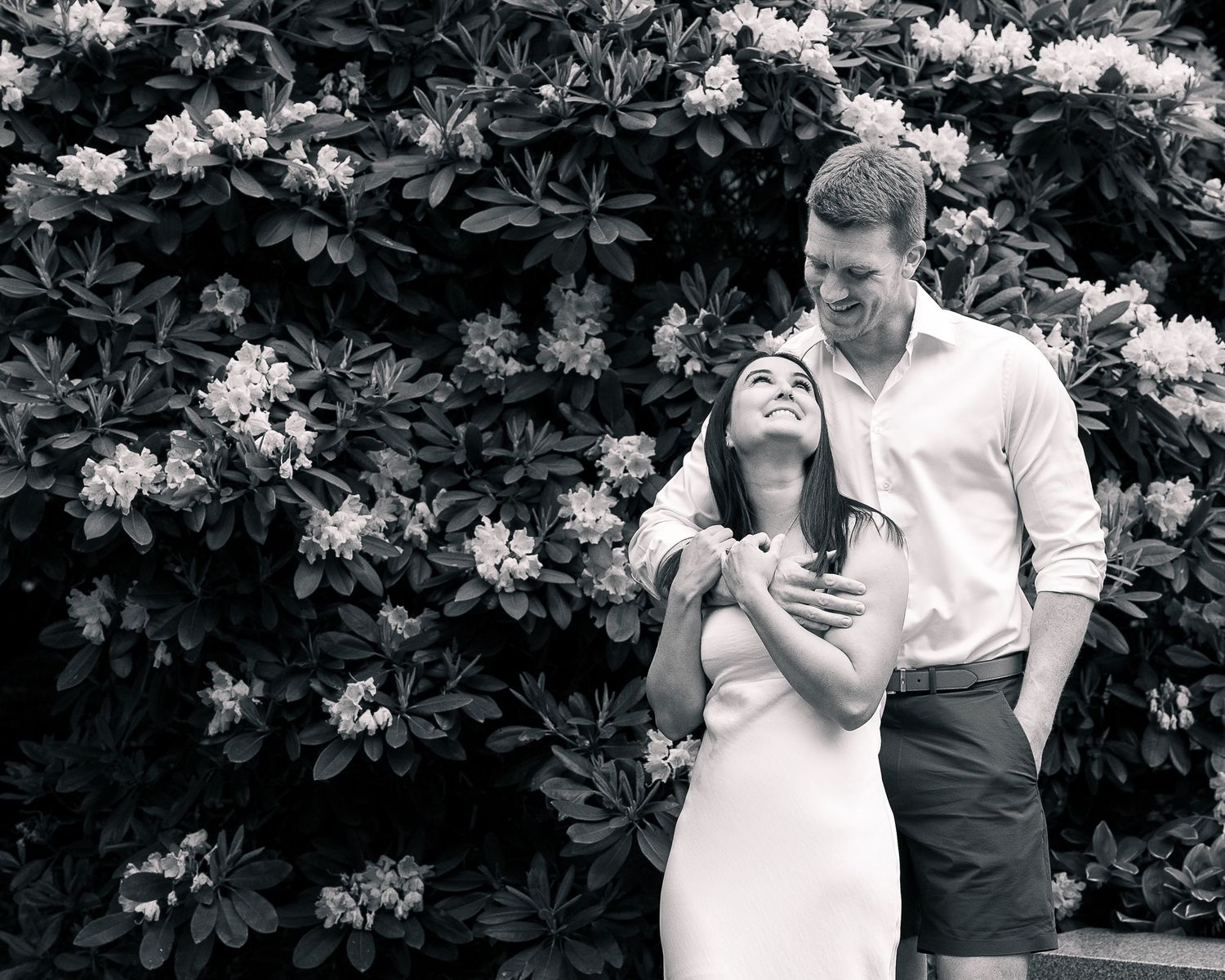 Couple embracing in rhododendron garden, Woodbridge CT elopement photographer