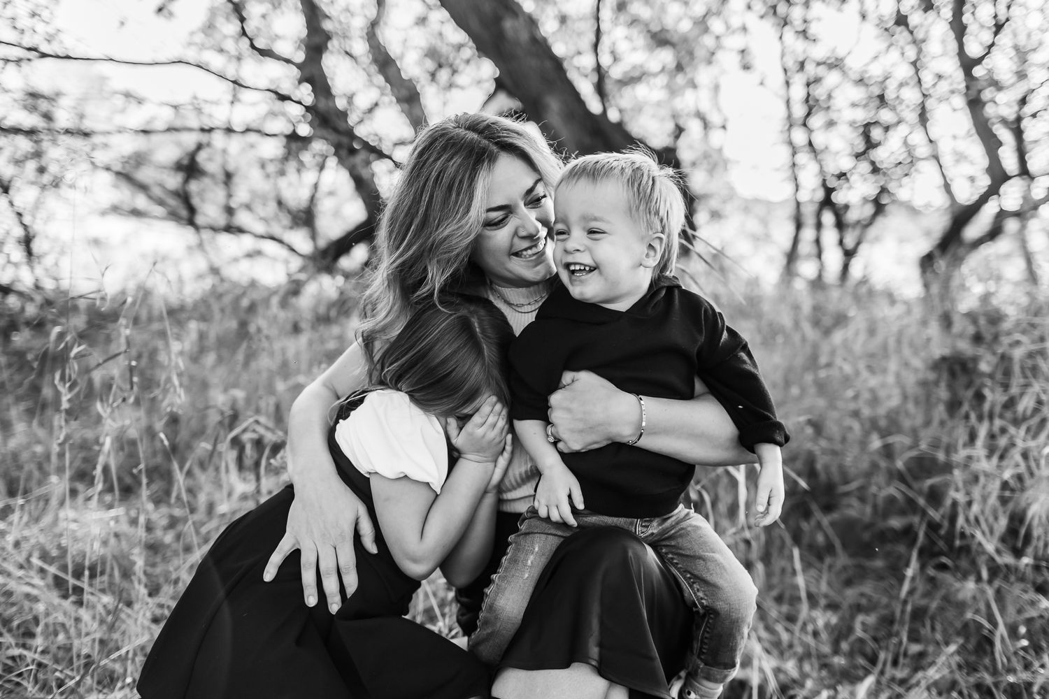A candid black and white photo showing genuine joy and connection between two people.