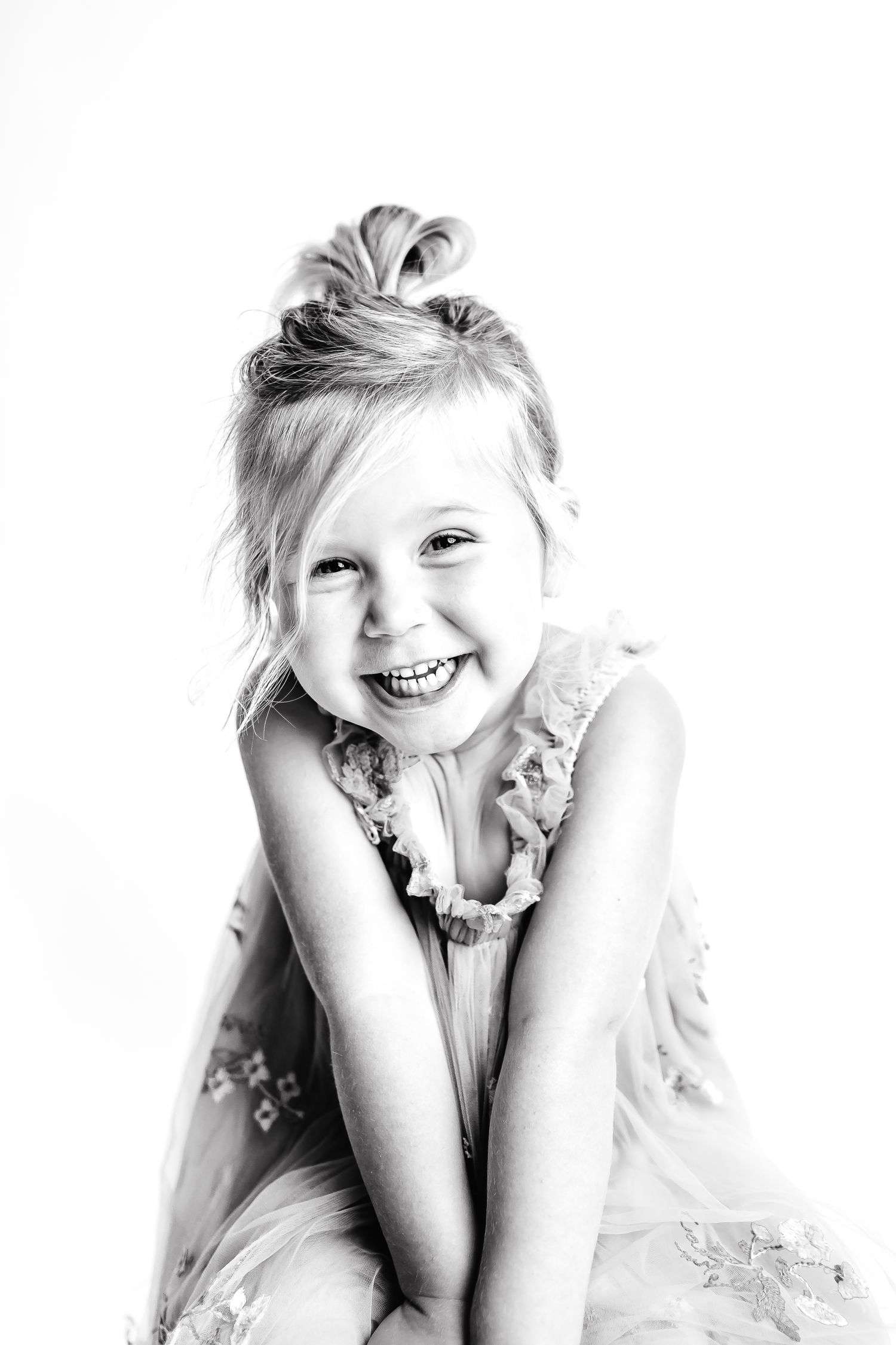Black and white portraits capturing playful poses and expressions.