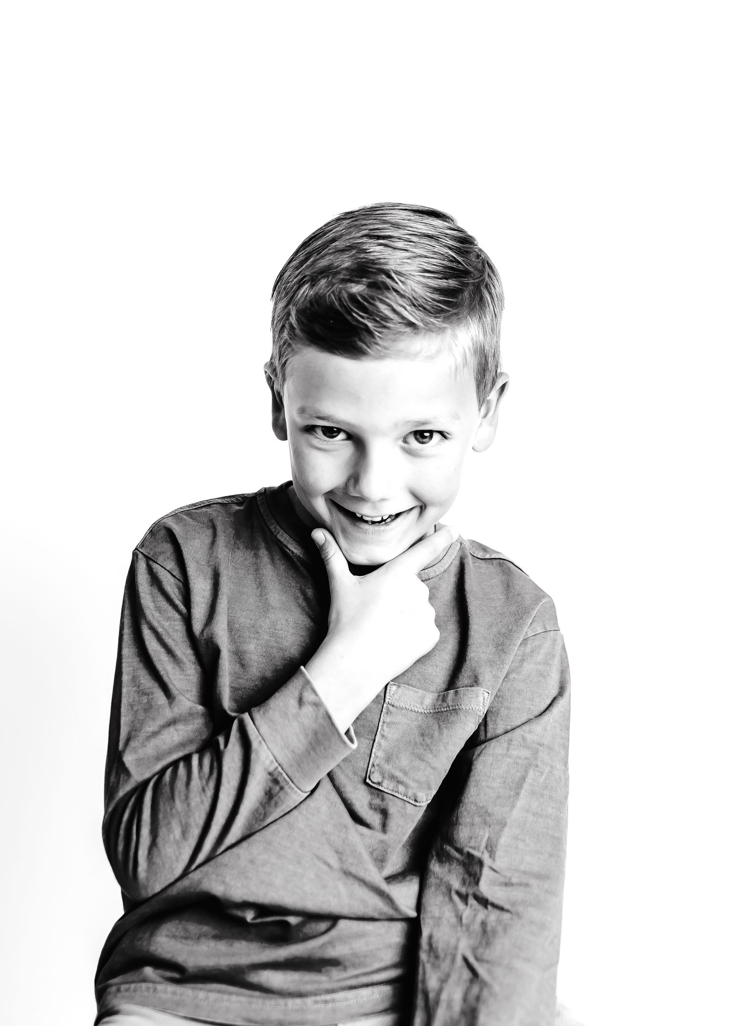 A black and white photo series shows four progressive expressions changing from serious to joyful.