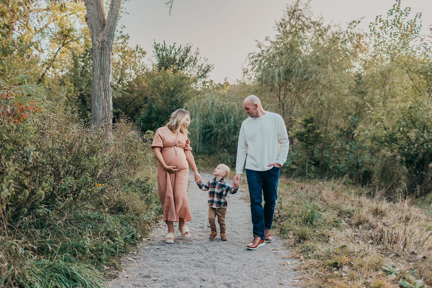 Seven candid family photos taken on a nature path during golden hour.