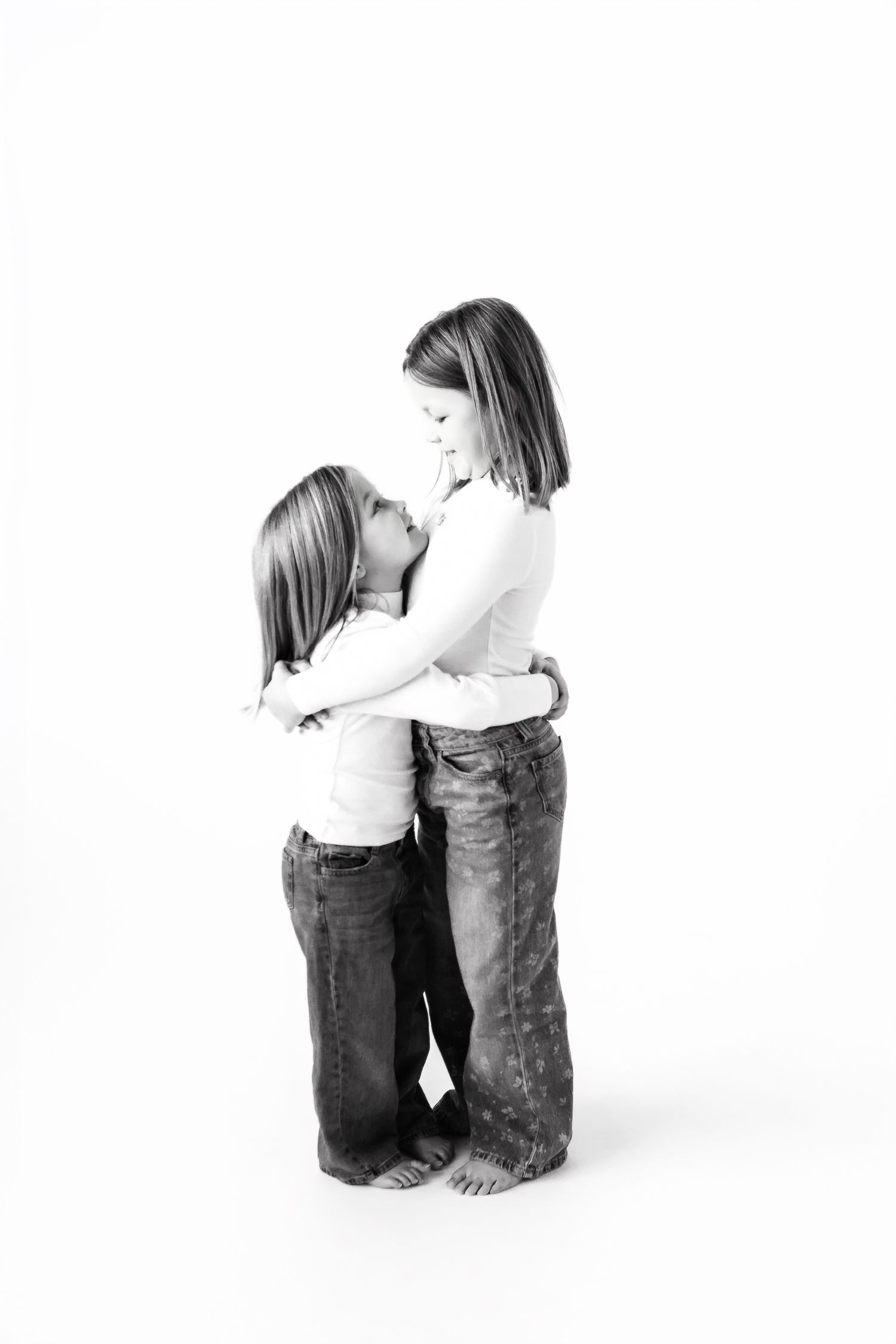 Black and white minimalist studio portraits showing emotional connection.