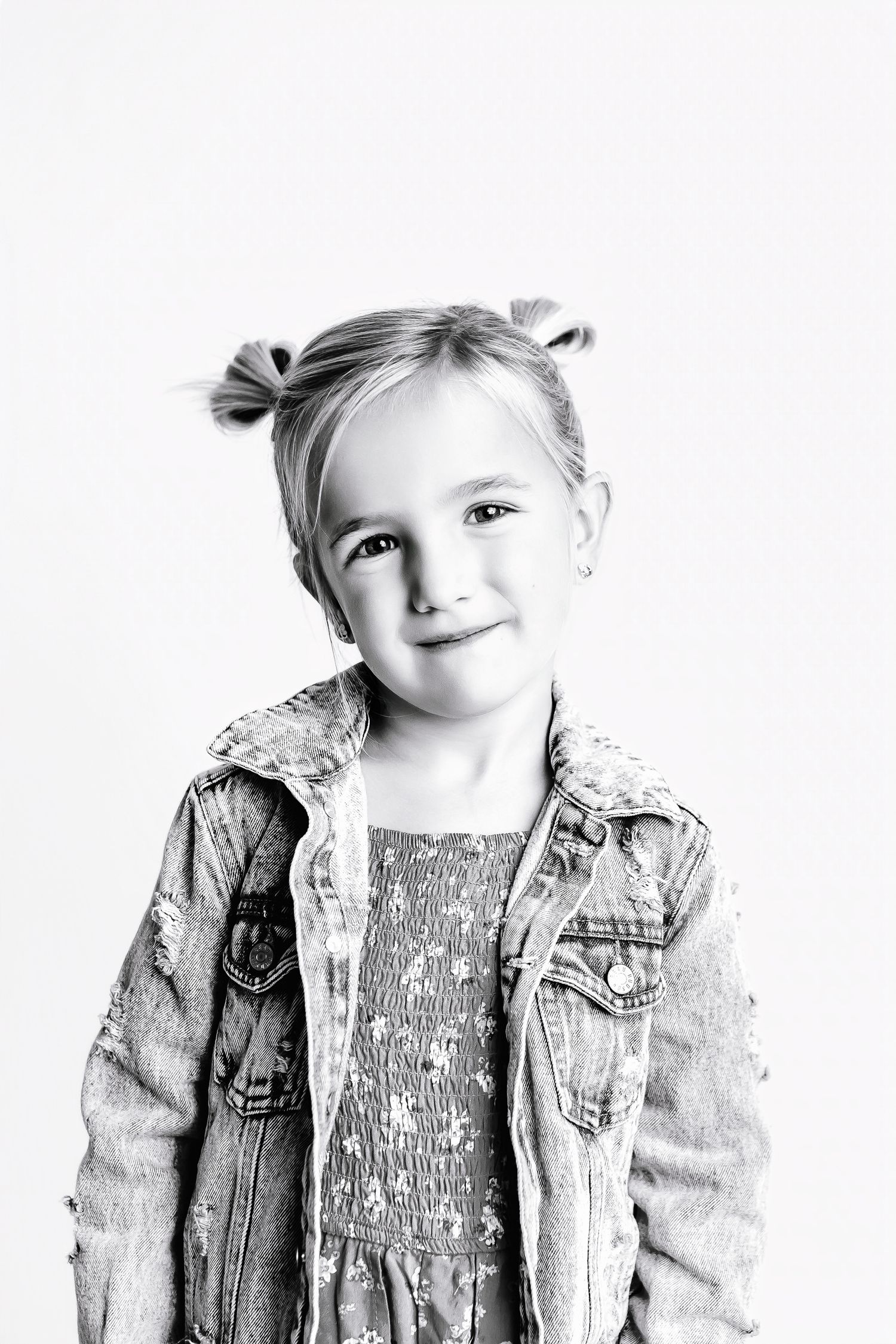 Multiple views of a child wearing a denim jacket in black and white photography.