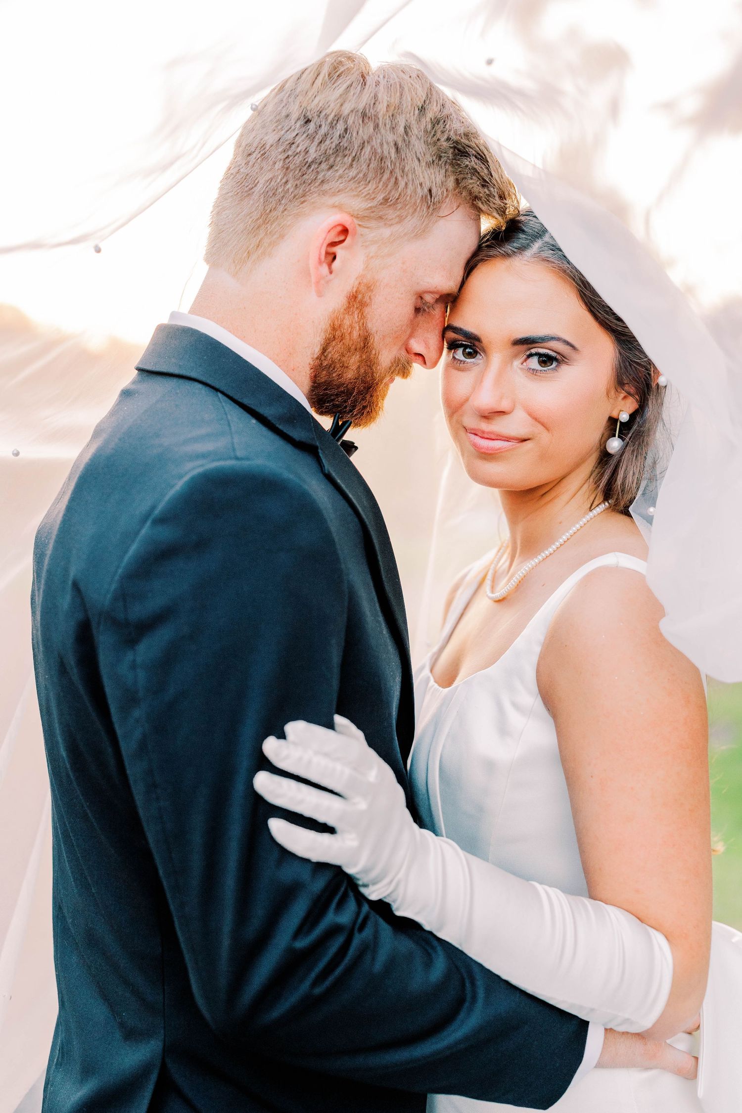 A romantic wedding couple shares intimate moments in three soft-focus portraits wearing formal attire and white gloves.