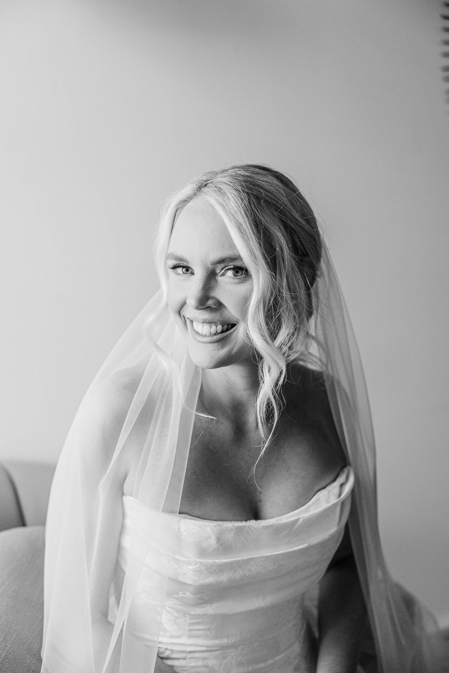 Artistic black and white bridal portraits showing flowing veil details.