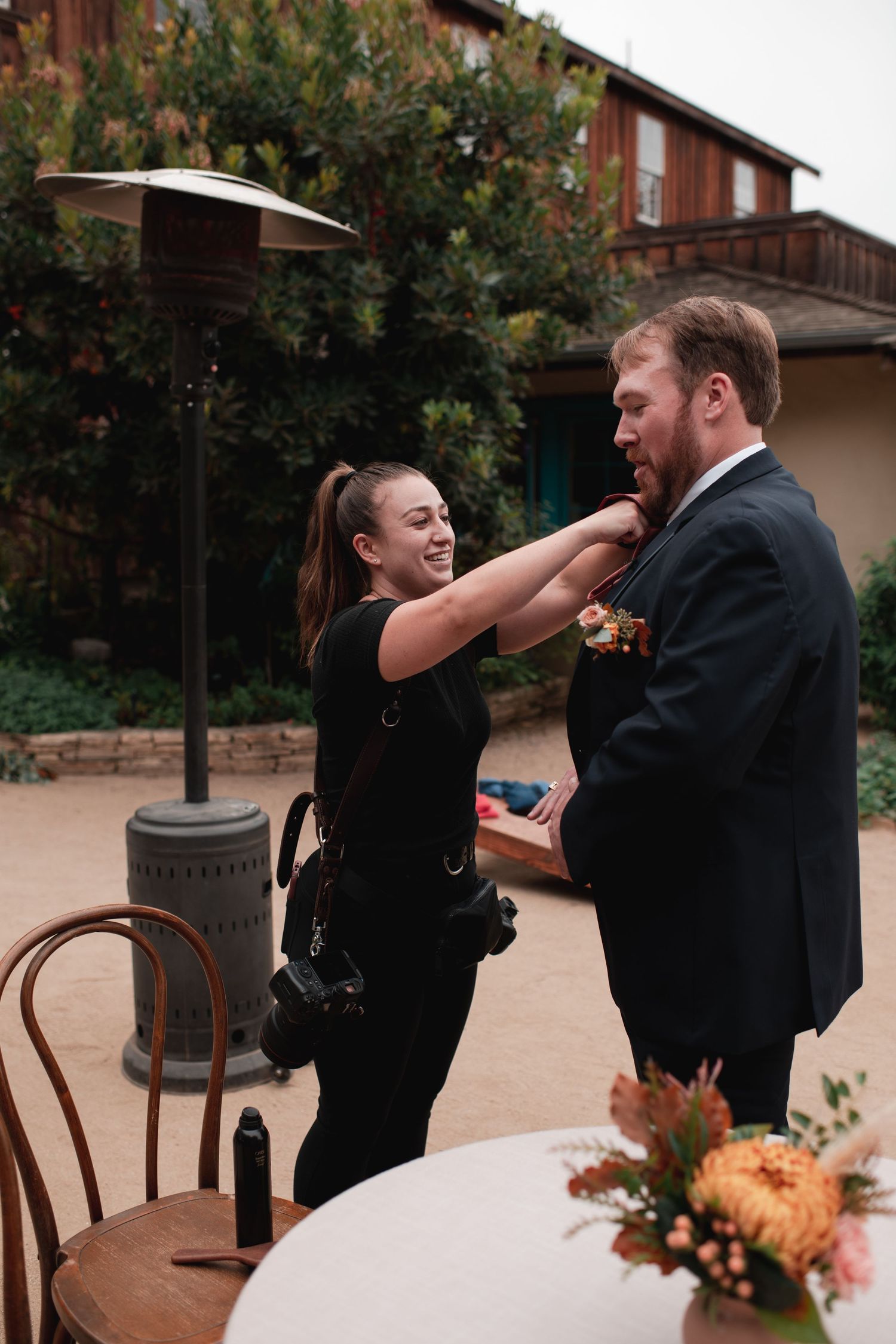 A playful sequence of two people sharing a fun moment while dining outdoors at a restaurant patio.