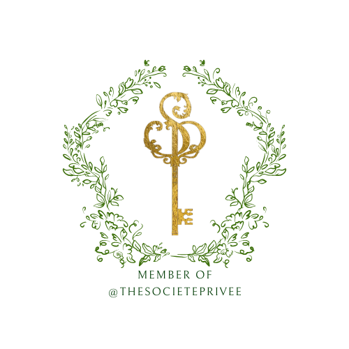 Gold ornate key with SP monogram inside a green laurel wreath, Member of @TheSocietePrivee logo.