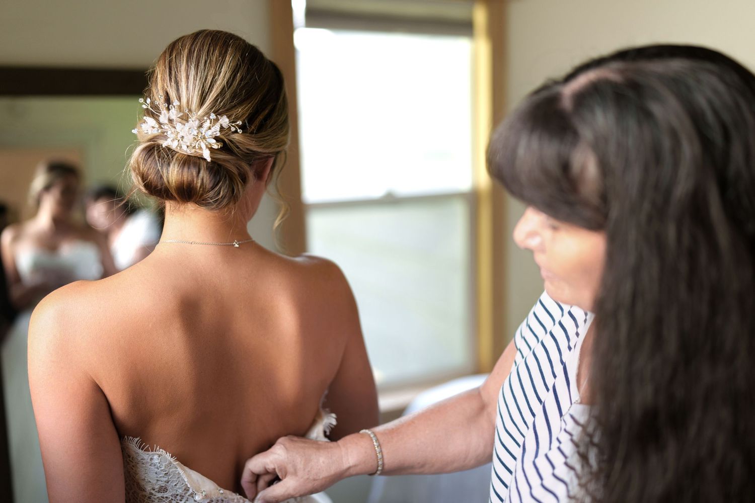 Close up of delicate bridal hair styling with ornate details.