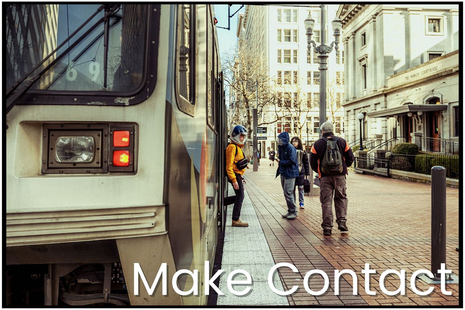 Urban street scene with pedestrians and a coffee cart in a downtown setting, overlaid with 'Make Contact' text.