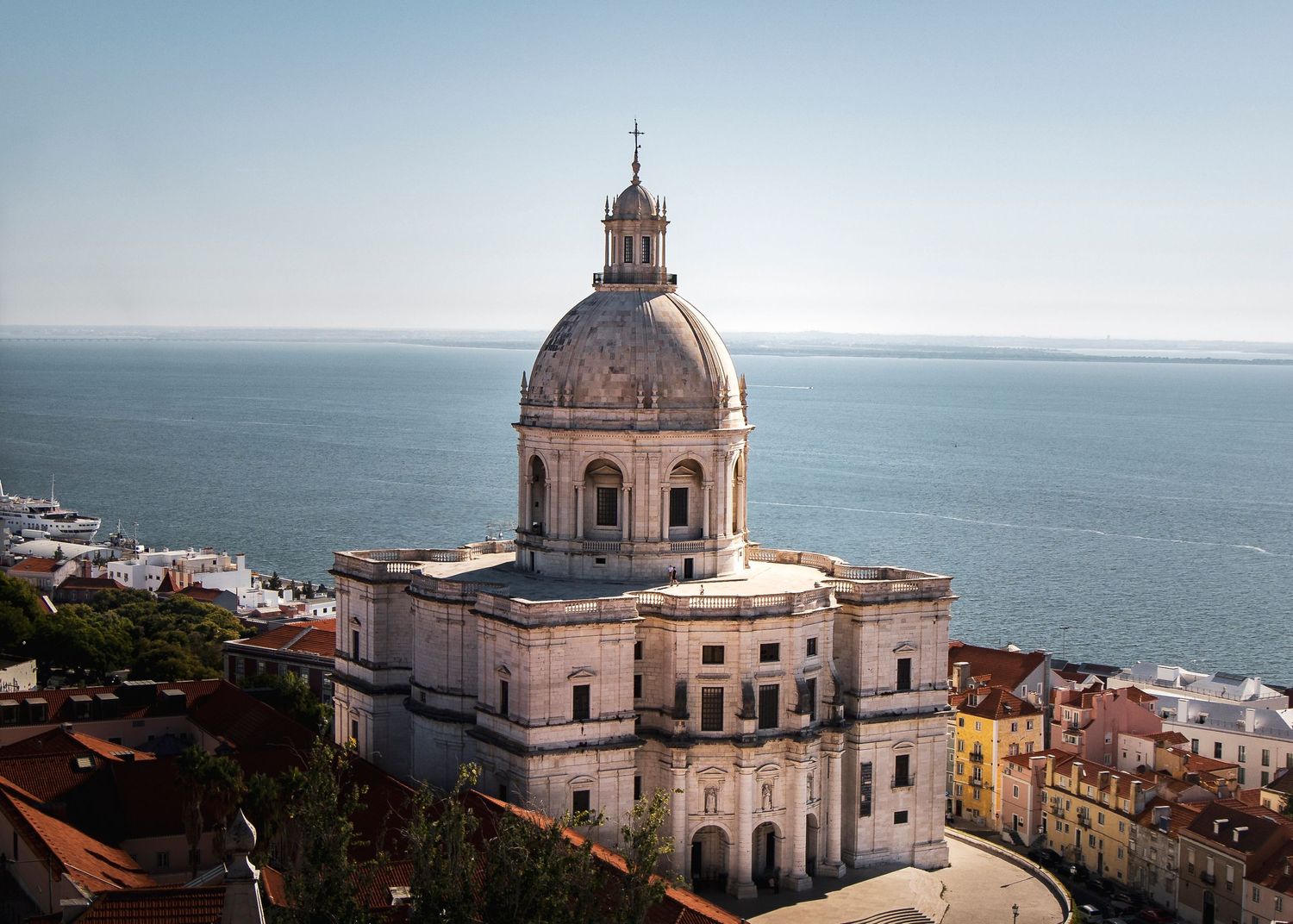 White domed National Sanctuary of Christ the King overlooking the ocean in Lisbon.