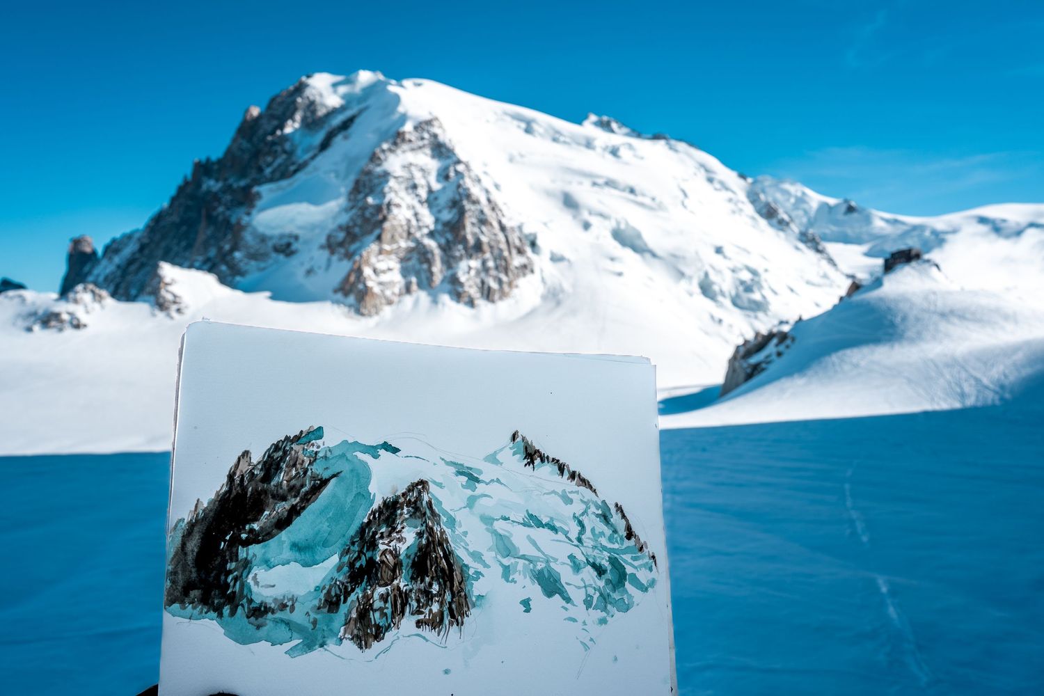 A painting of rocky mountain peaks displayed against a stunning snow-covered Alpine landscape under blue skies.