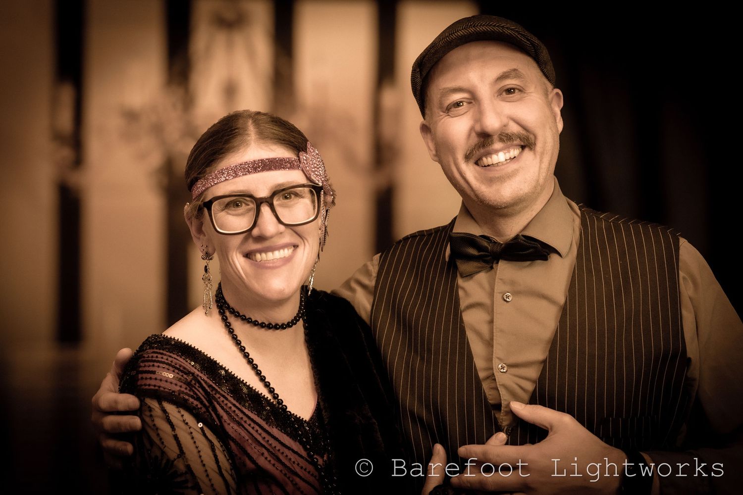 A photograph of a couple in a 1920's inspired outfit and filter. Roaring 20s.