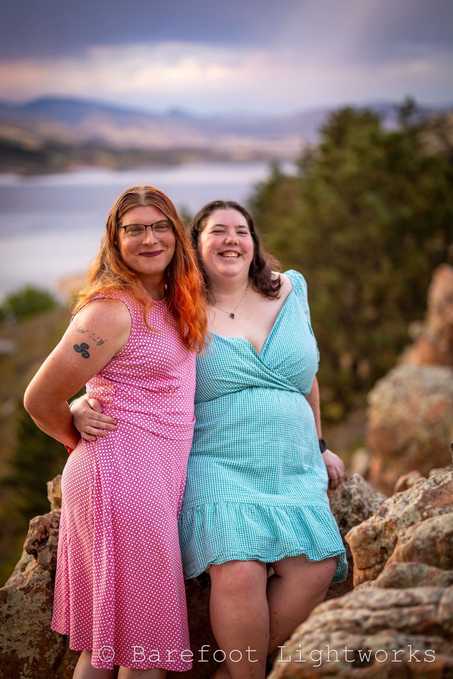 A photo of a couple, two women in a pink and blue dress at Horsetooth reservoir