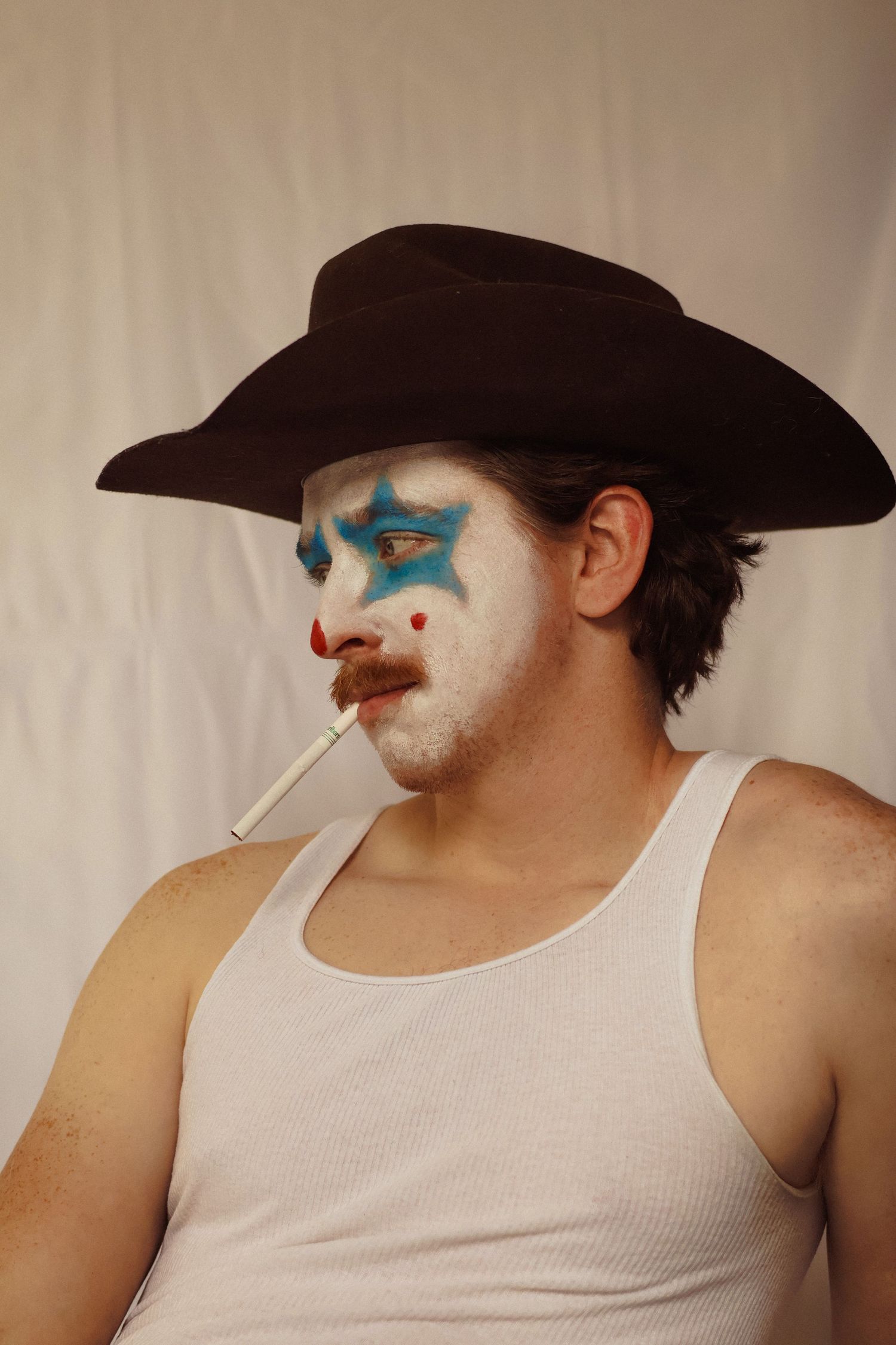Sad clown smokes a cigarette in this western rodeo inspired campaign.