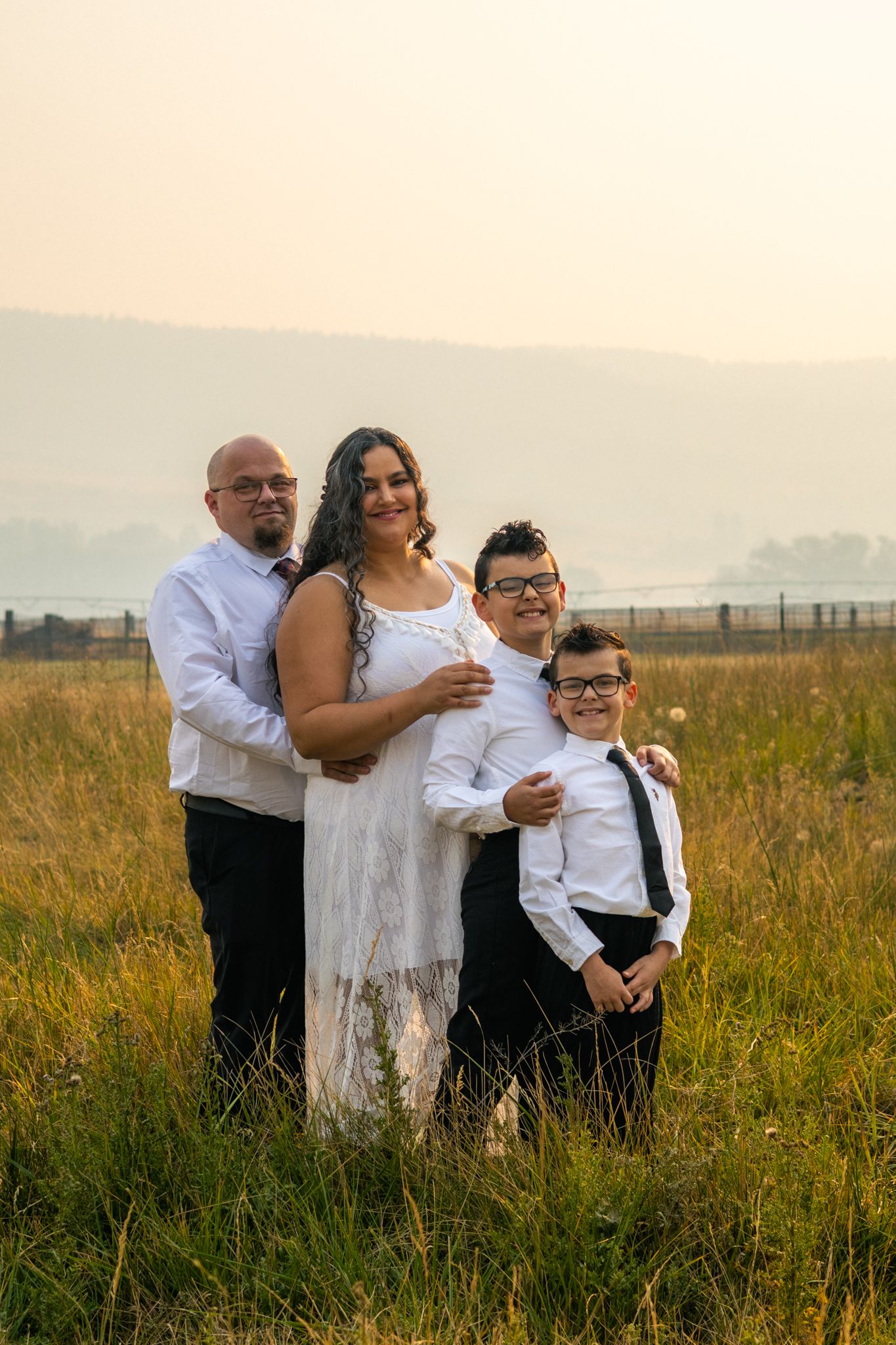An outdoor maternity family photoshoot in the hazy mountains of La Grande.