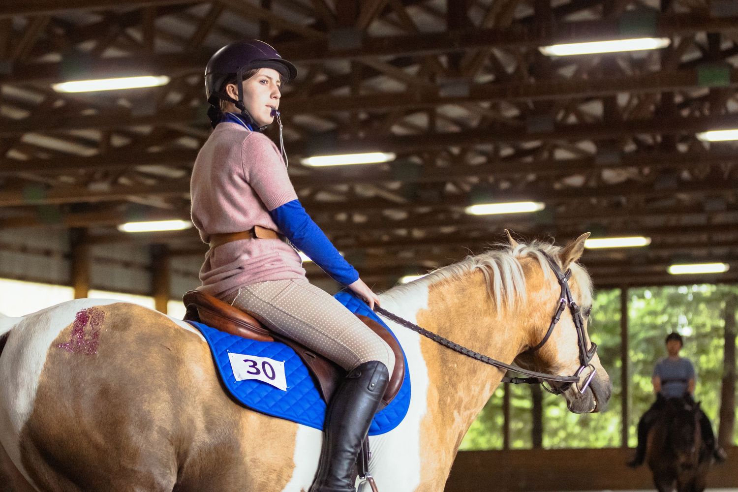 Horse show photography coverage showing a young rider during her pony club performance.