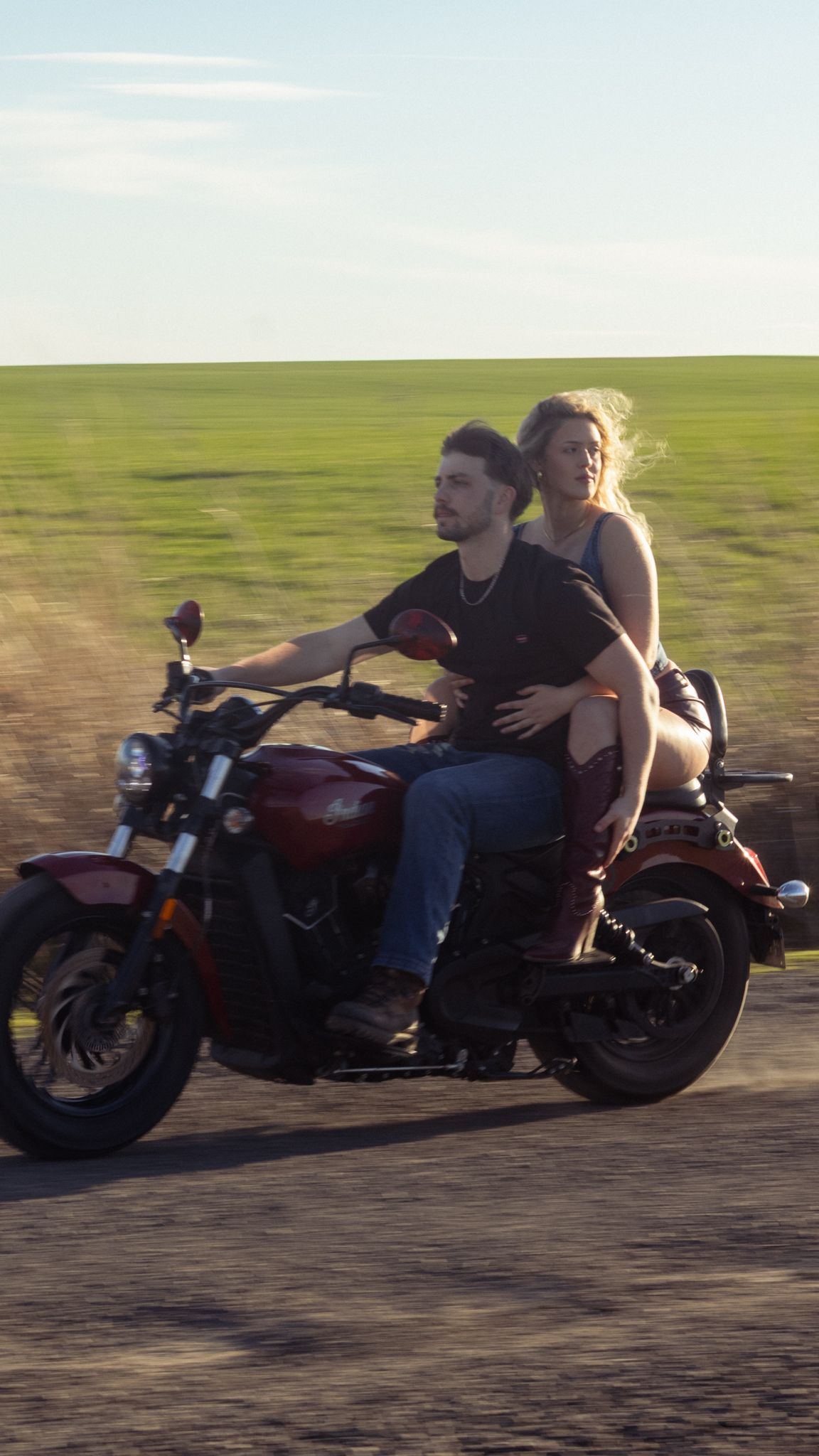 A young couple find love together on a motorcycle on the back roads.