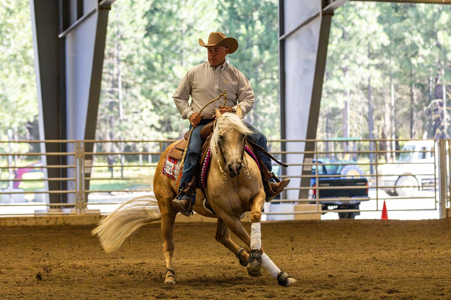 Horse show photography coverage showing a reining horse spin in this action shot at Washington State Horse Park.