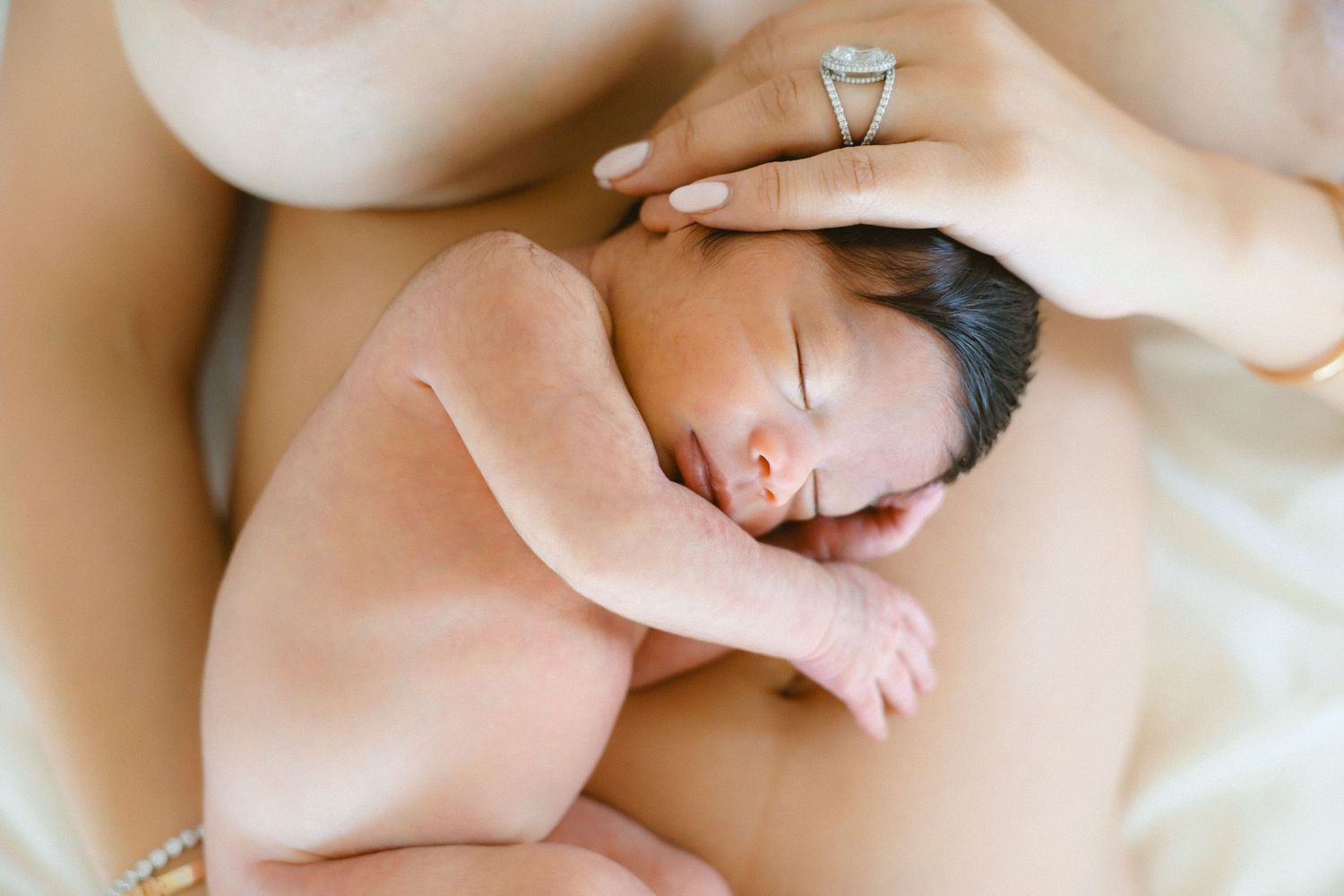 newborn on mother's belly