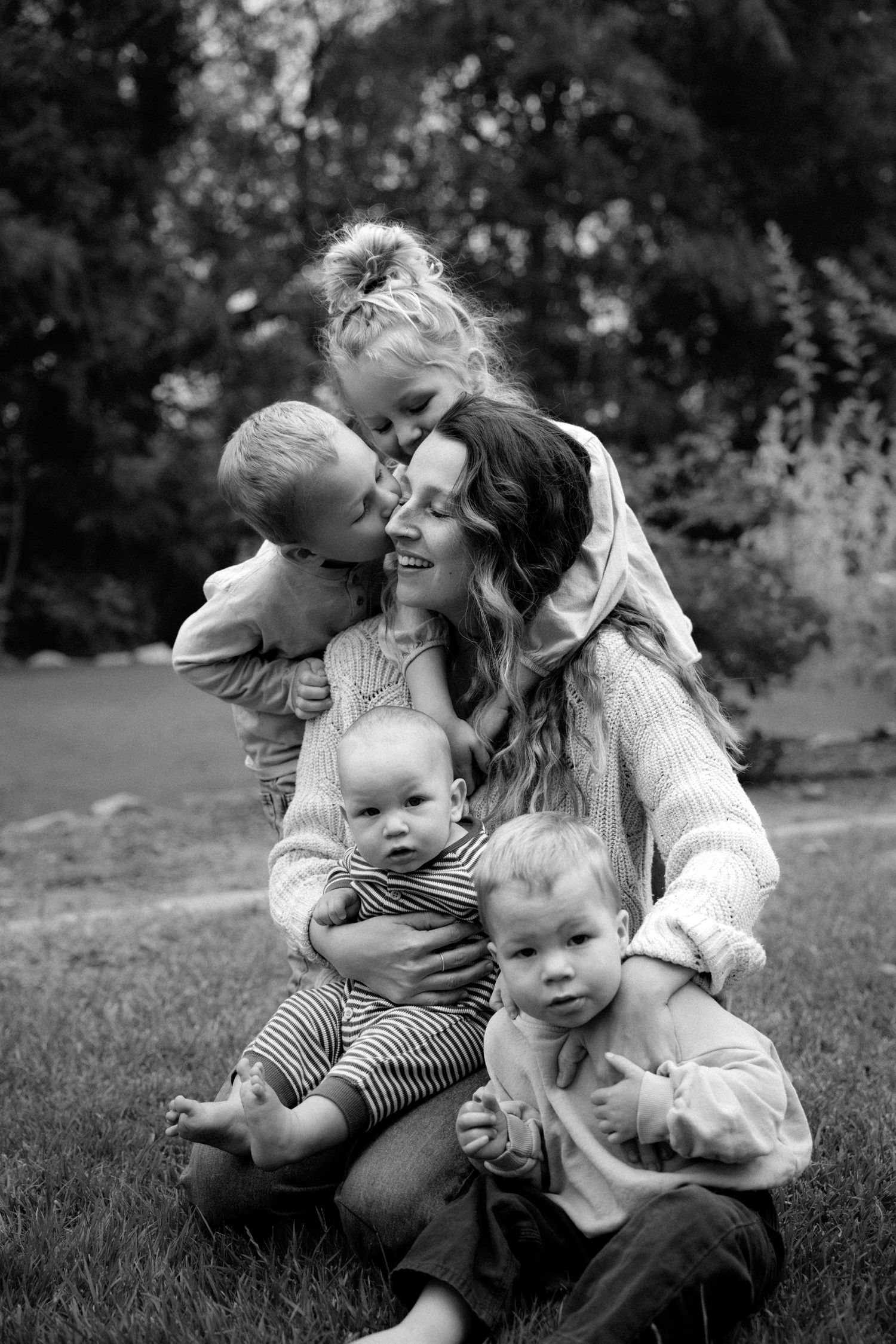 kids hugging their mom