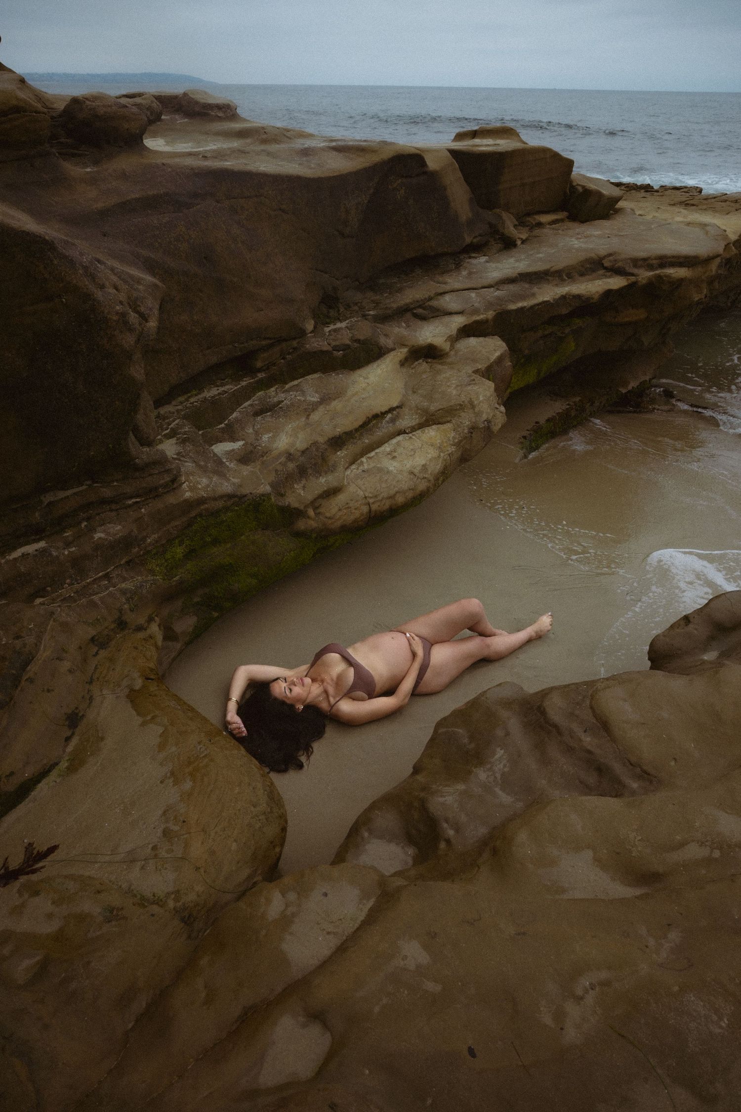 maternity photos by the water and in a cave