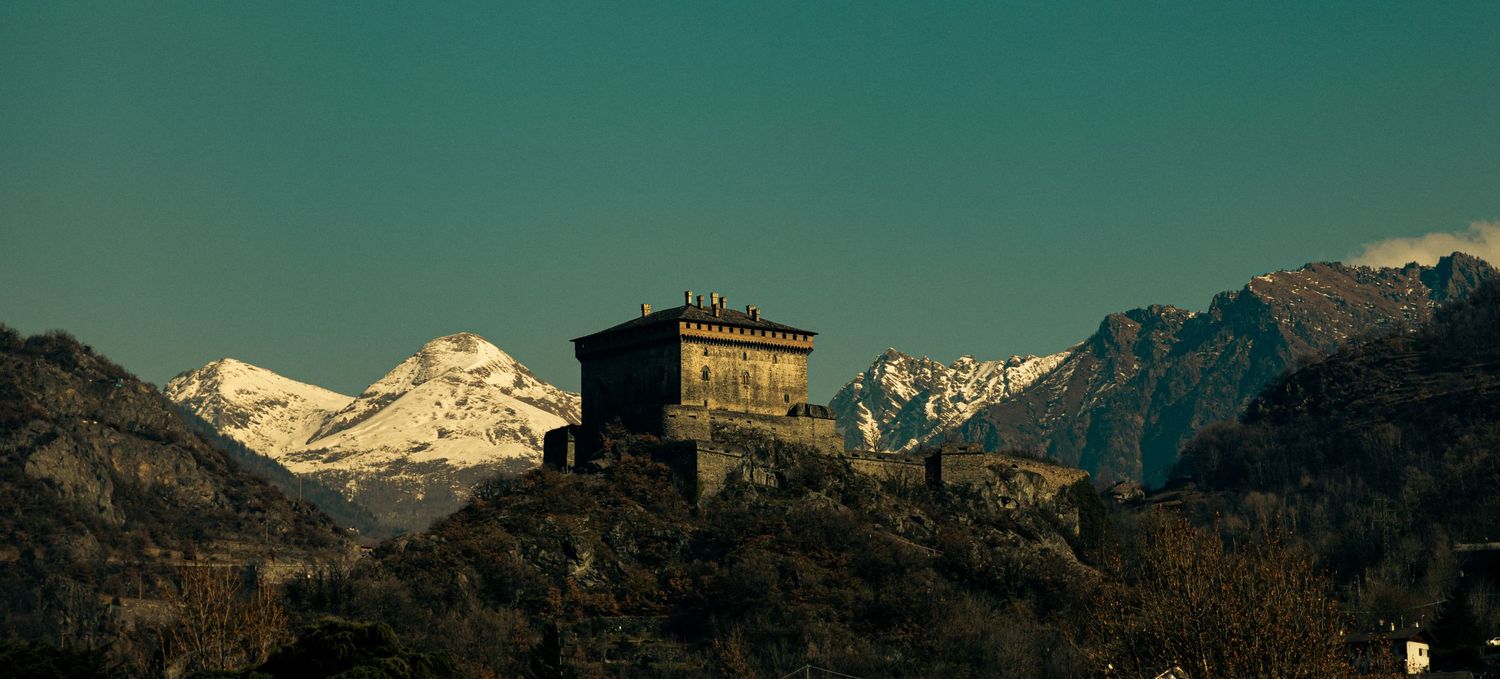 cinematic shot of a building in the alpes