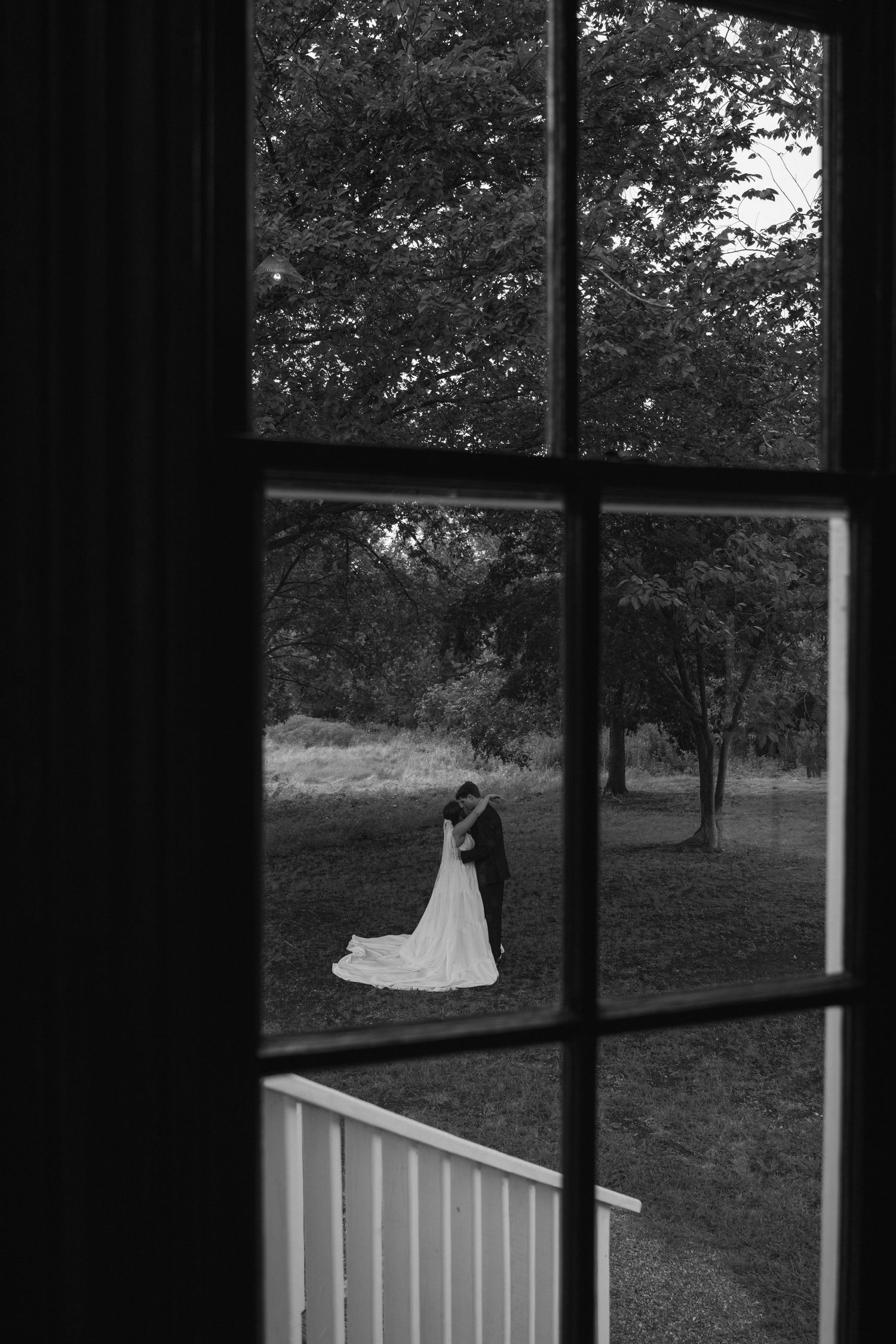 Couple dancing photograph captured through a stained glass window after their wedding ceremony in Utah