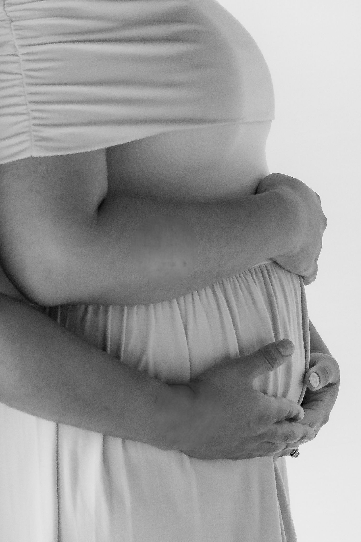 preganat belly holding hands