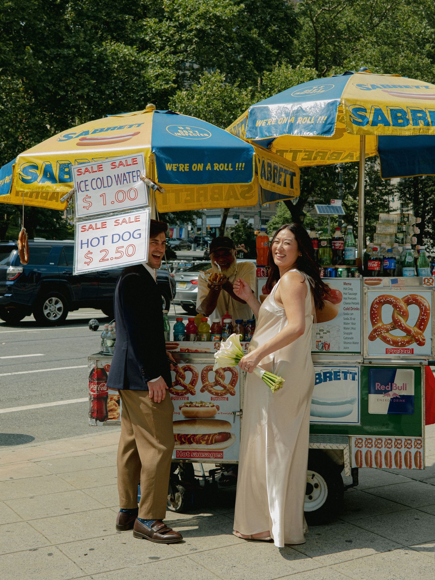 Sequence of photos by Sabrett hot dog carts showing a couple enjoying a casual moment on the sidewalk.