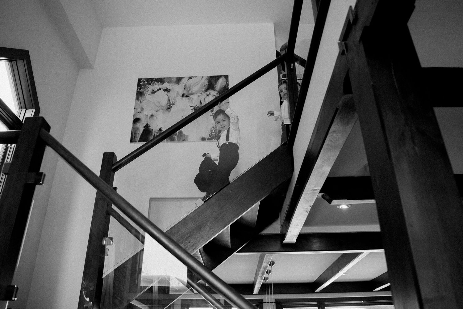 Abstract black and white architectural interior shot showing angular lines and shadows.
