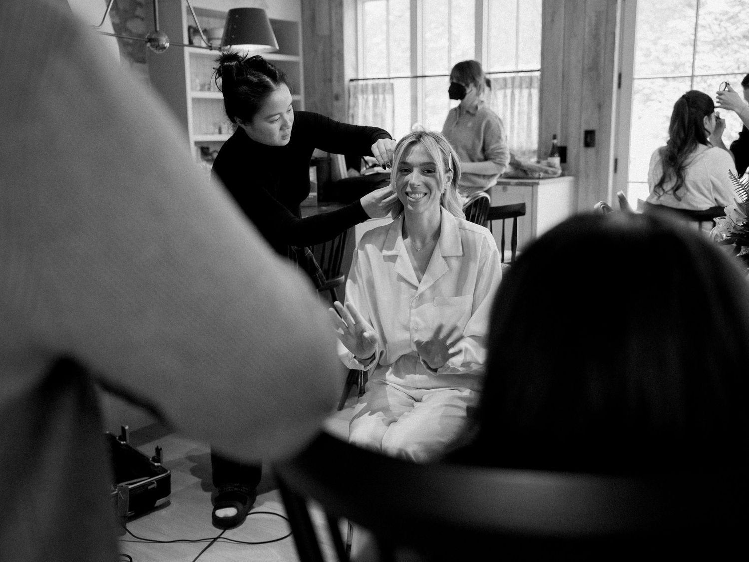 Black and white images of wedding day preparations in a sunlit room.