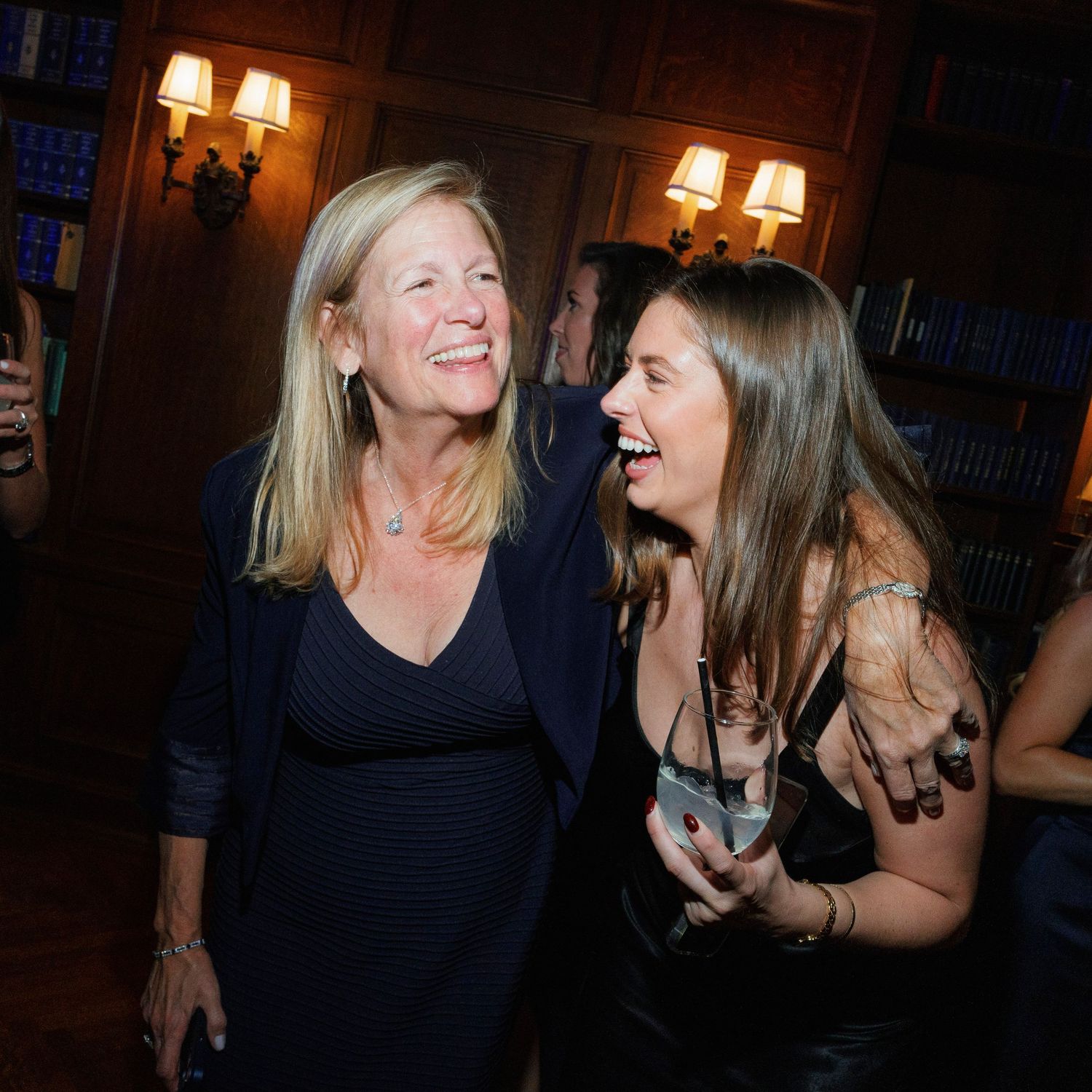 Sequence of candid moments showing laughter and conversation at an evening event.