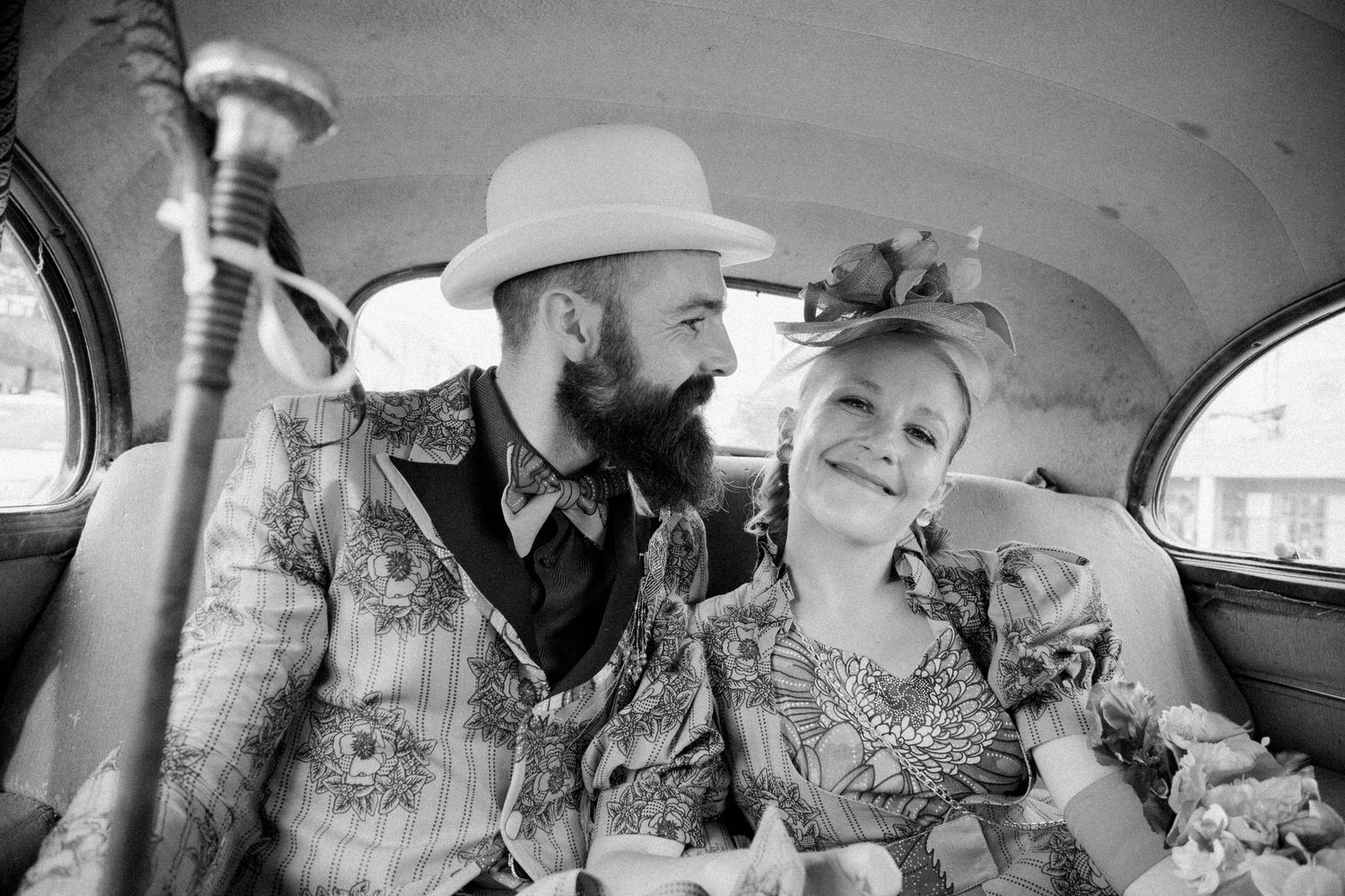 Vintage-style black and white photos taken inside a classic car.