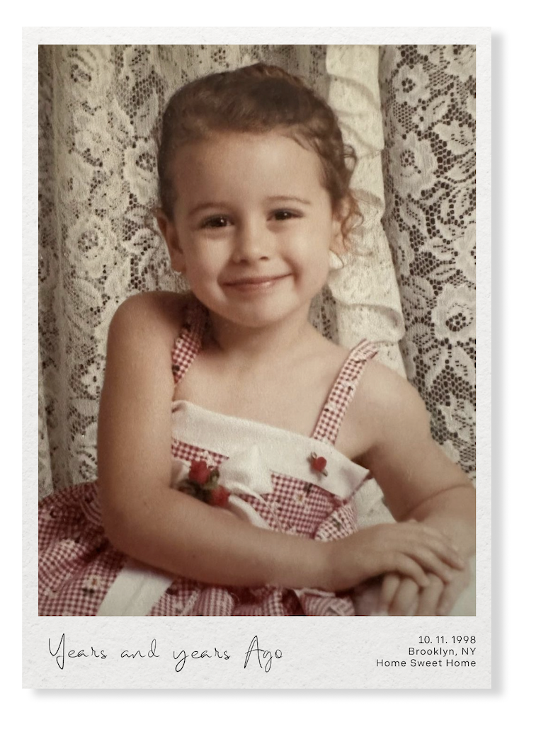 Vintage-style portrait with lace curtain background in sepia tones.