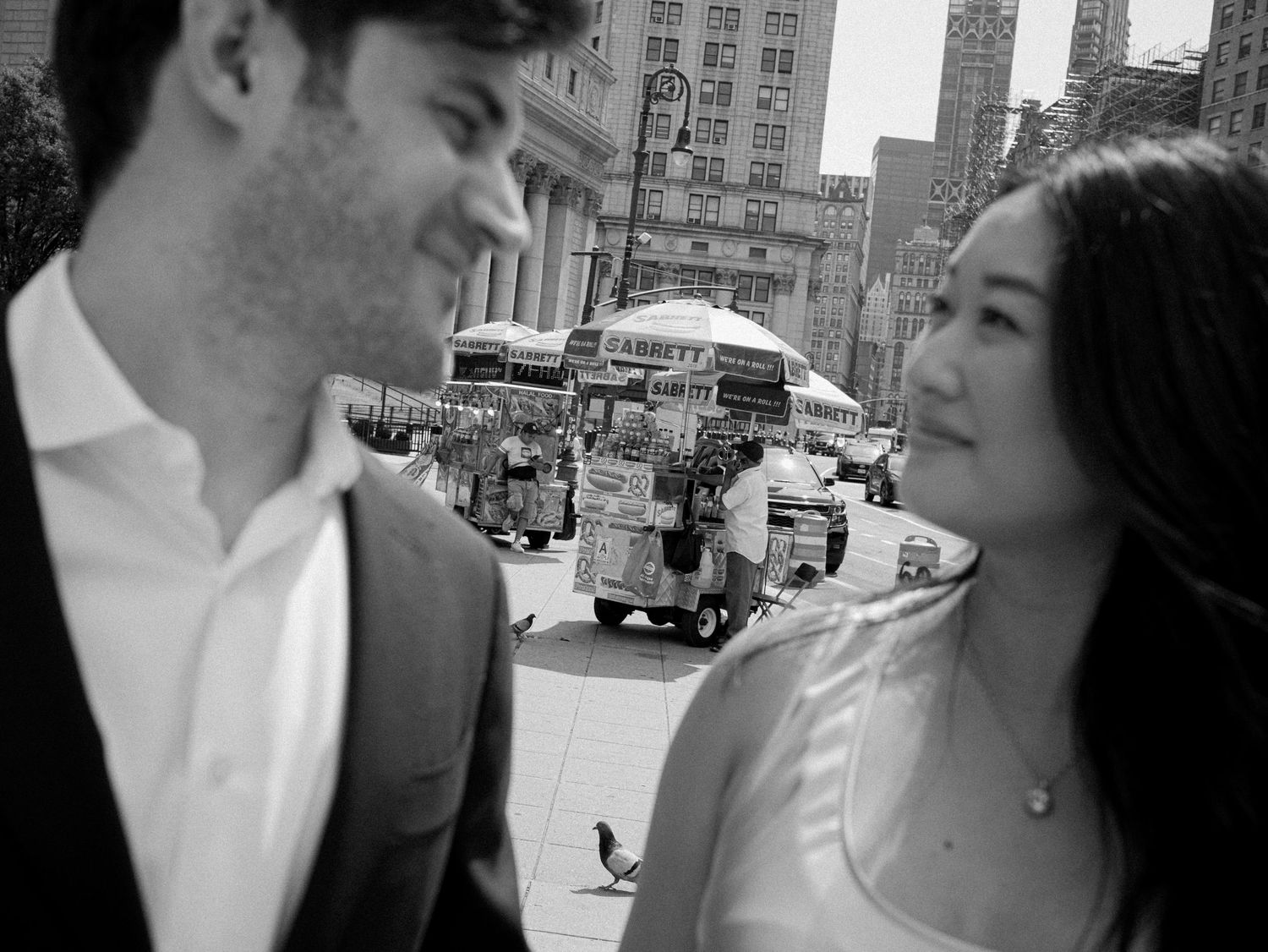 Urban street photography sequence showing intimate moments between two people in black and white.